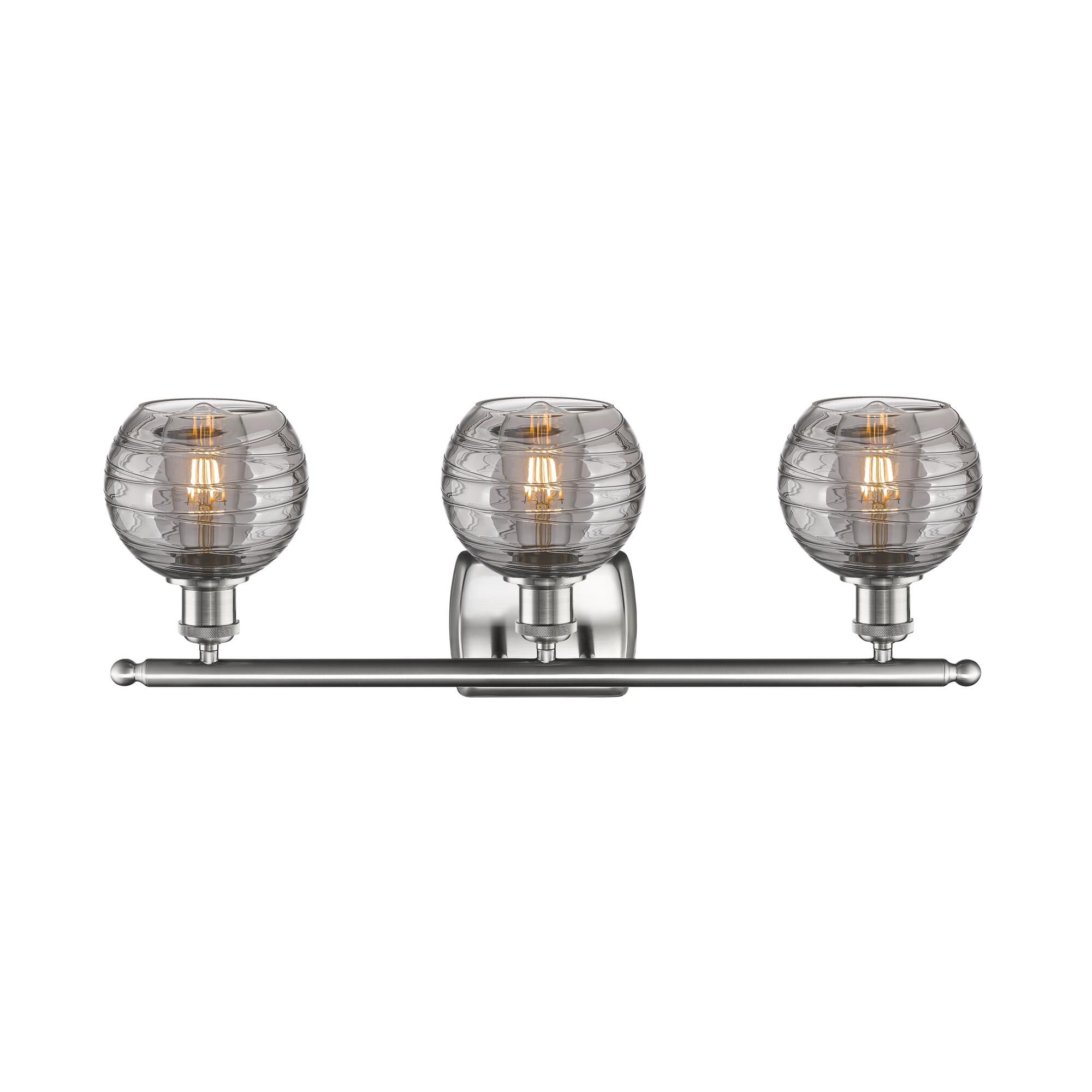 Shown in Brushed Satin Nickel finish and Light Smoke Deco Swirl glass