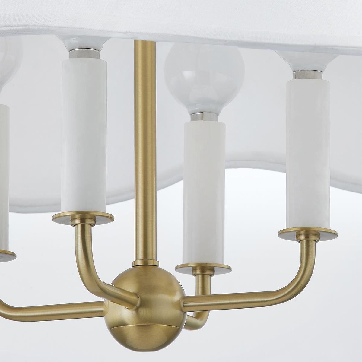 Shown in Aged Brass finish and White Linen shade