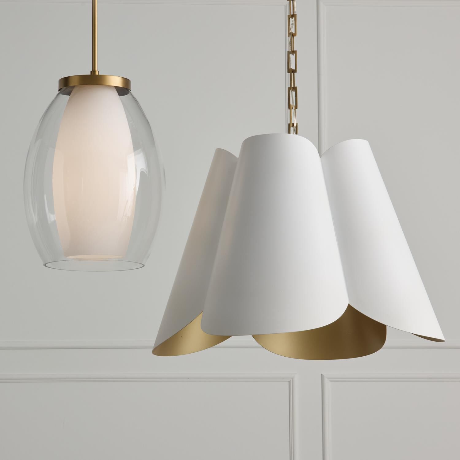 Shown in Aged Brass finish and Layered White and Clear glass