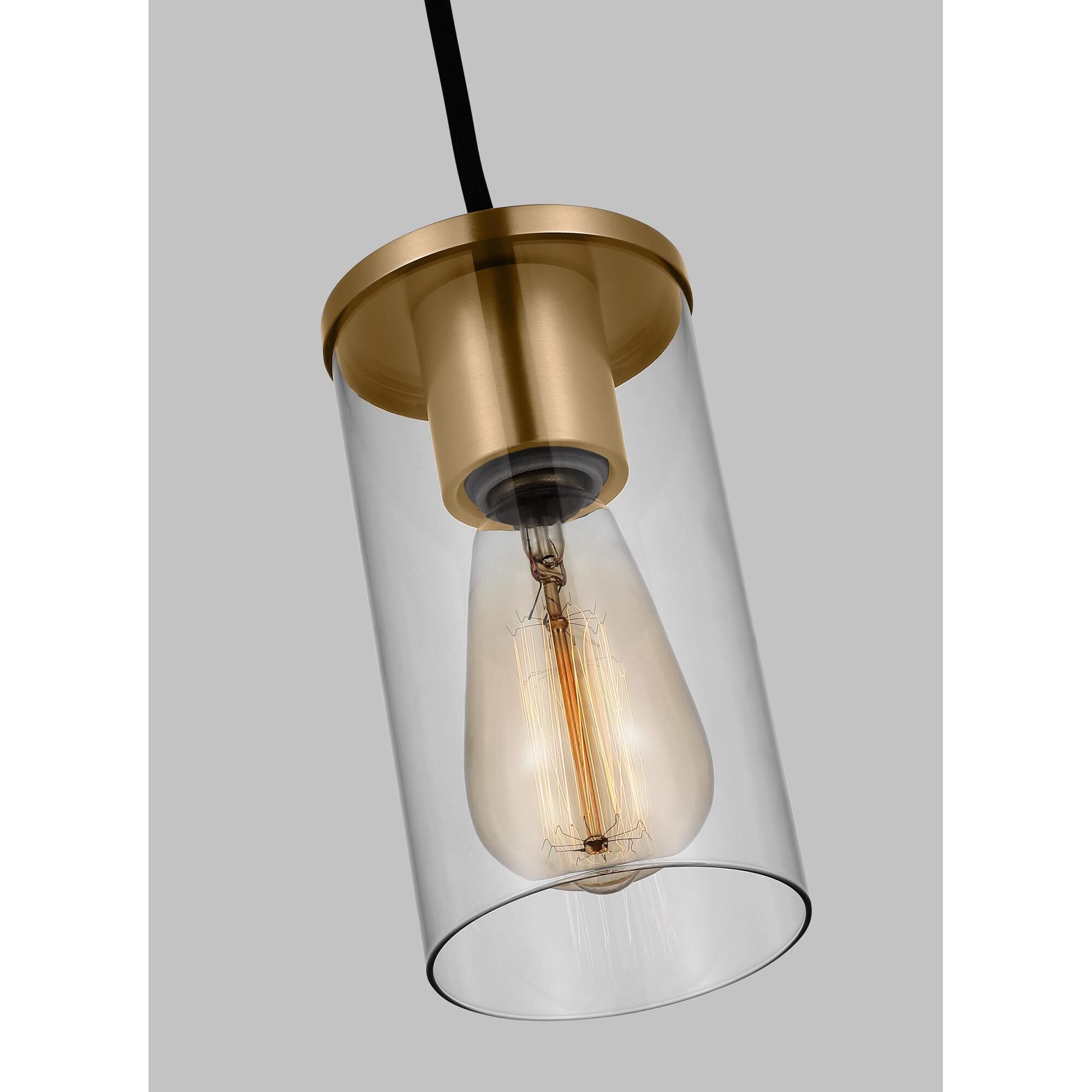 Shown in Satin Brass finish and Clear Glass shade