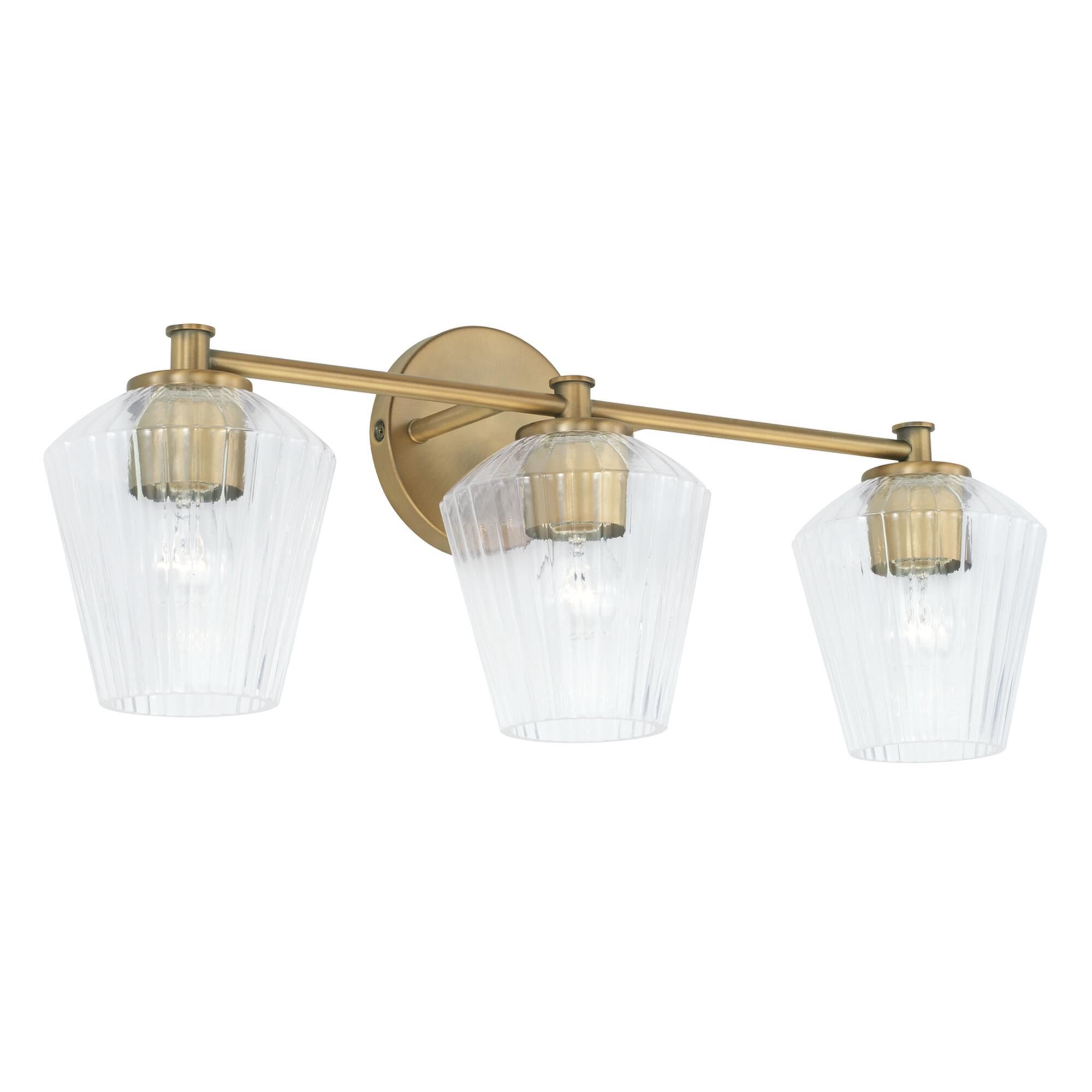 Shown in Aged Brass finish and Clear Fluted glass
