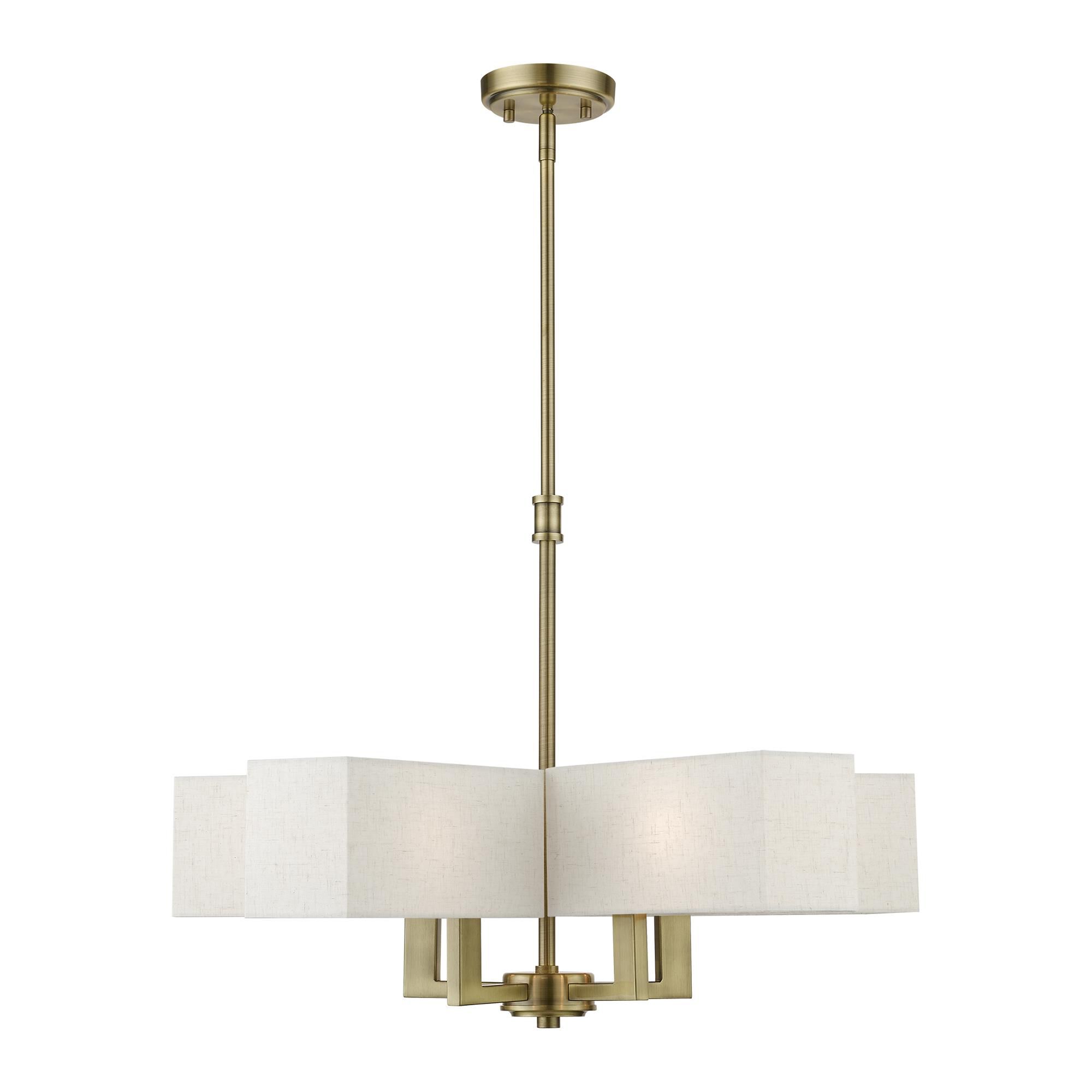 Shown in Antique Brass finish and Hand Crafted Oatmeal Color Hardback Fabric With White Fabric Inside shade