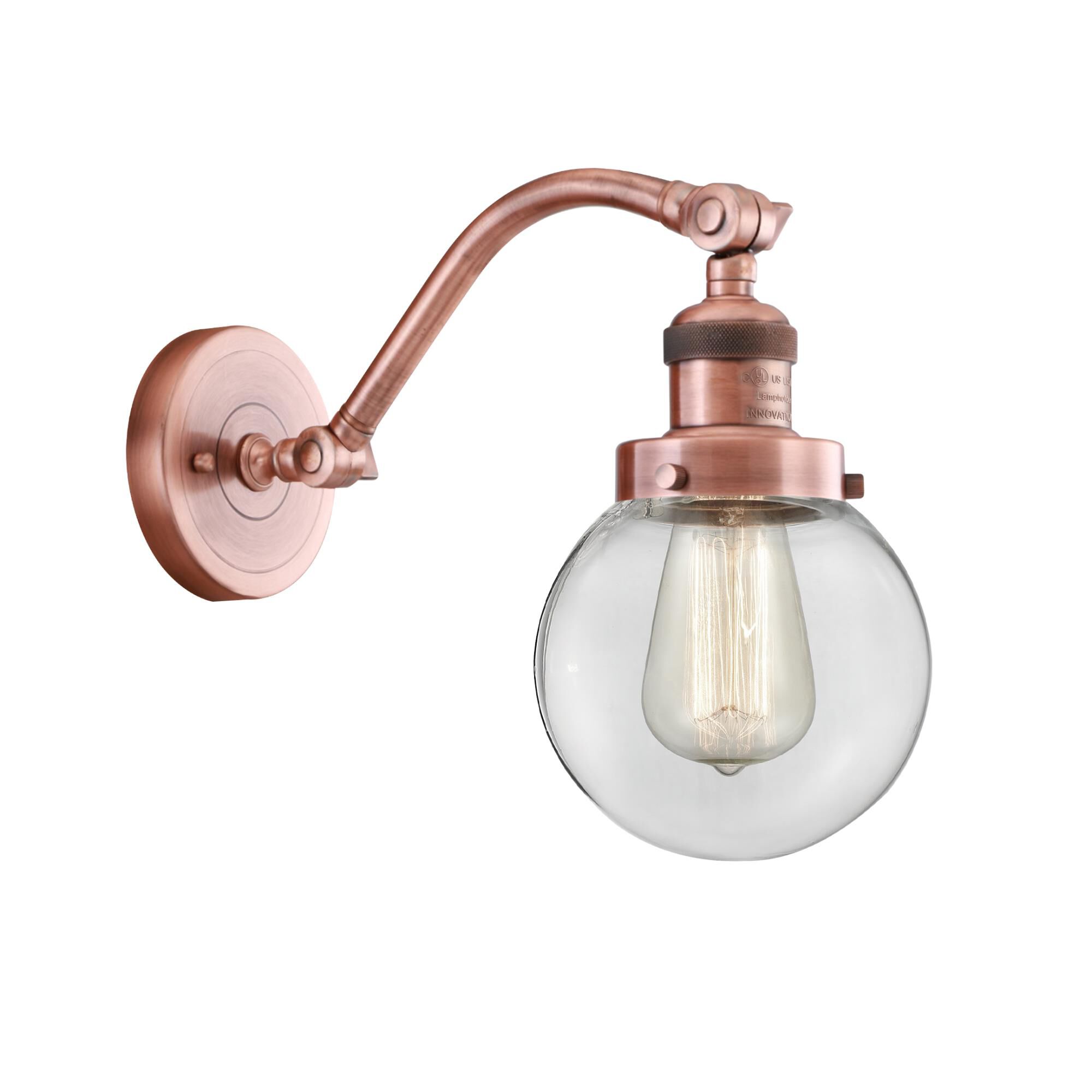 Shown in Antique Copper finish and Clear Beacon glass