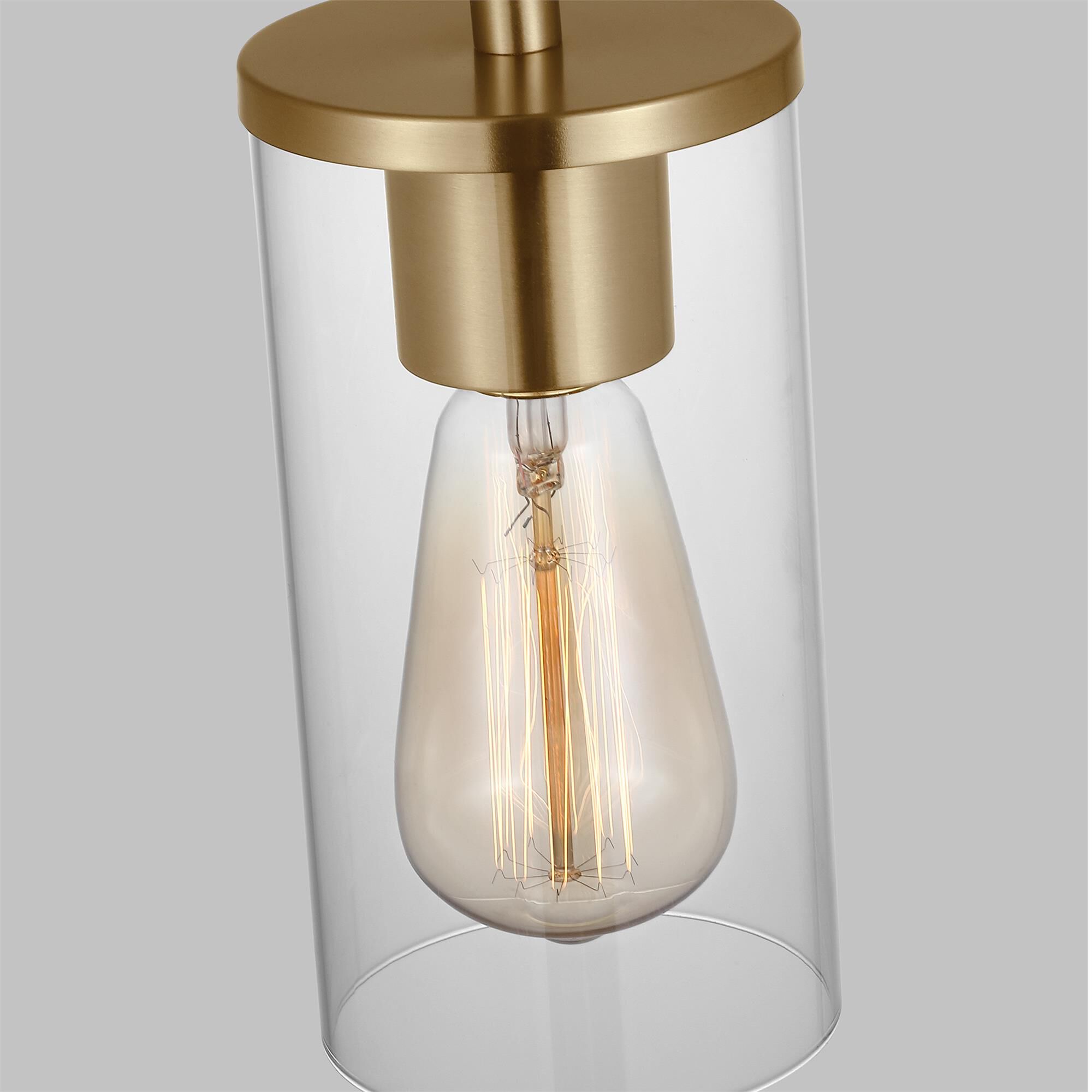 Shown in Satin Brass finish and Clear Glass shade