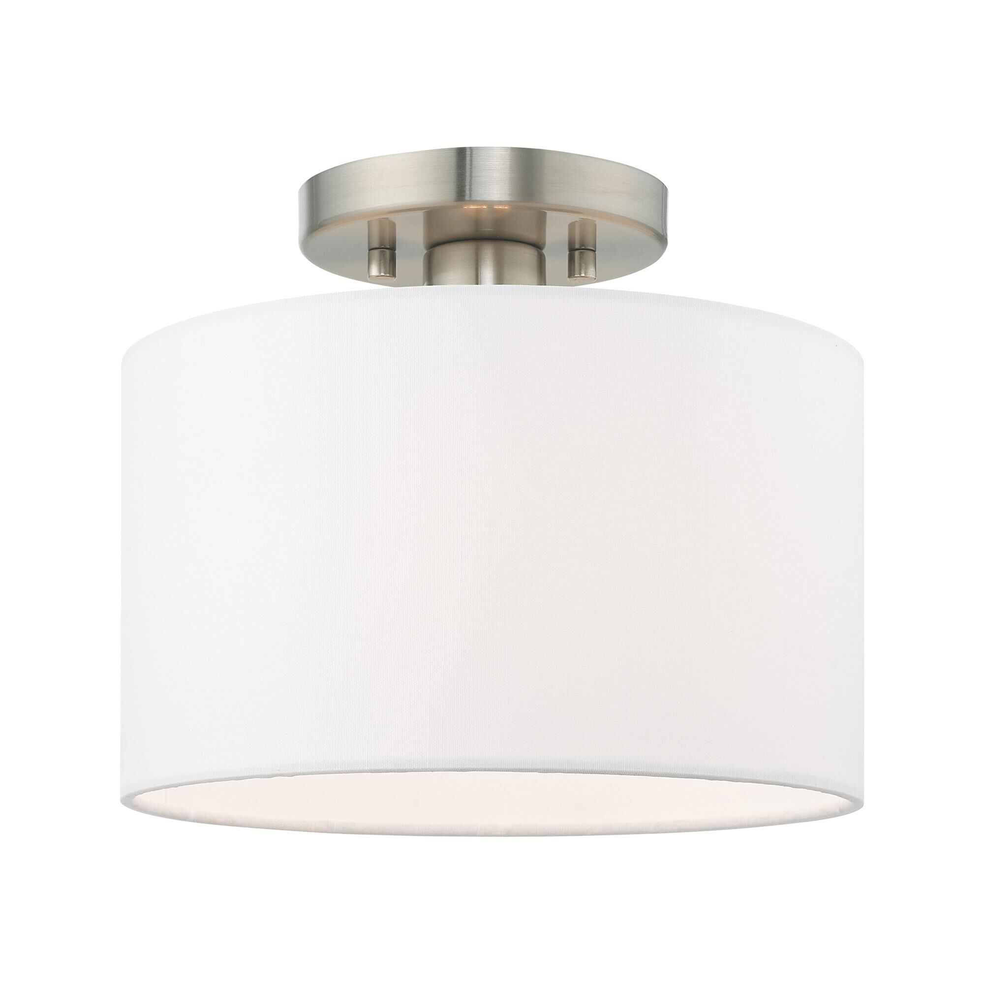 Shown in Brushed Nickel finish and Hand Crafted Off-White Fabric Hardback shade