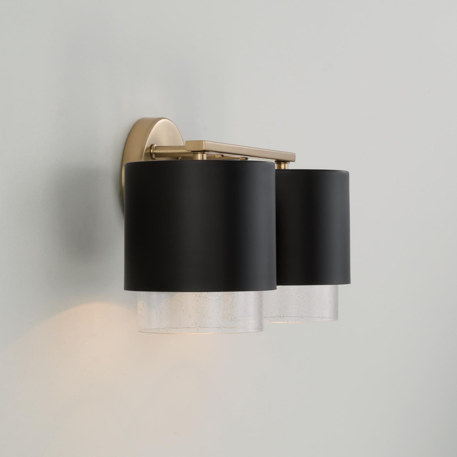 Shown in Matte Brass and Black finish and Clear Seeded glass and Metal with Brass Interior shade