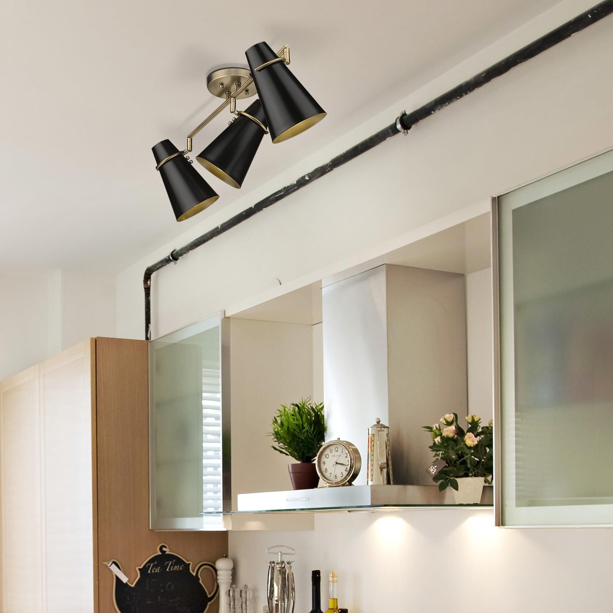 Shown in Modern Brass finish and Matte Black glass