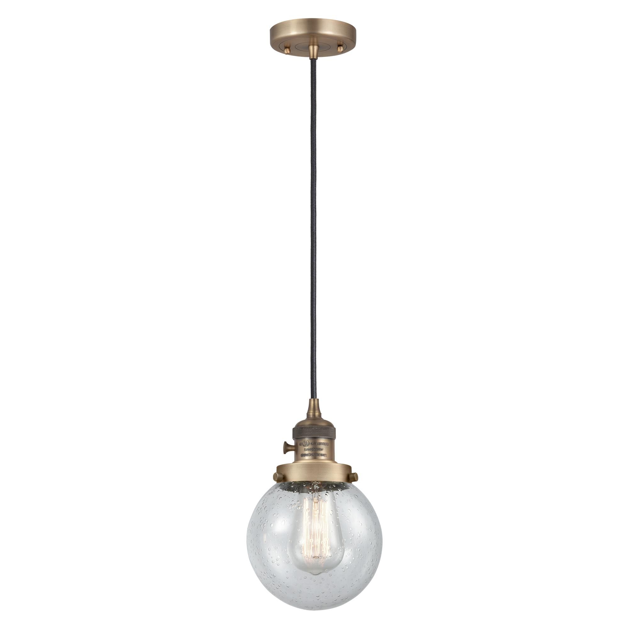 Shown in Brushed Brass finish and Seedy glass