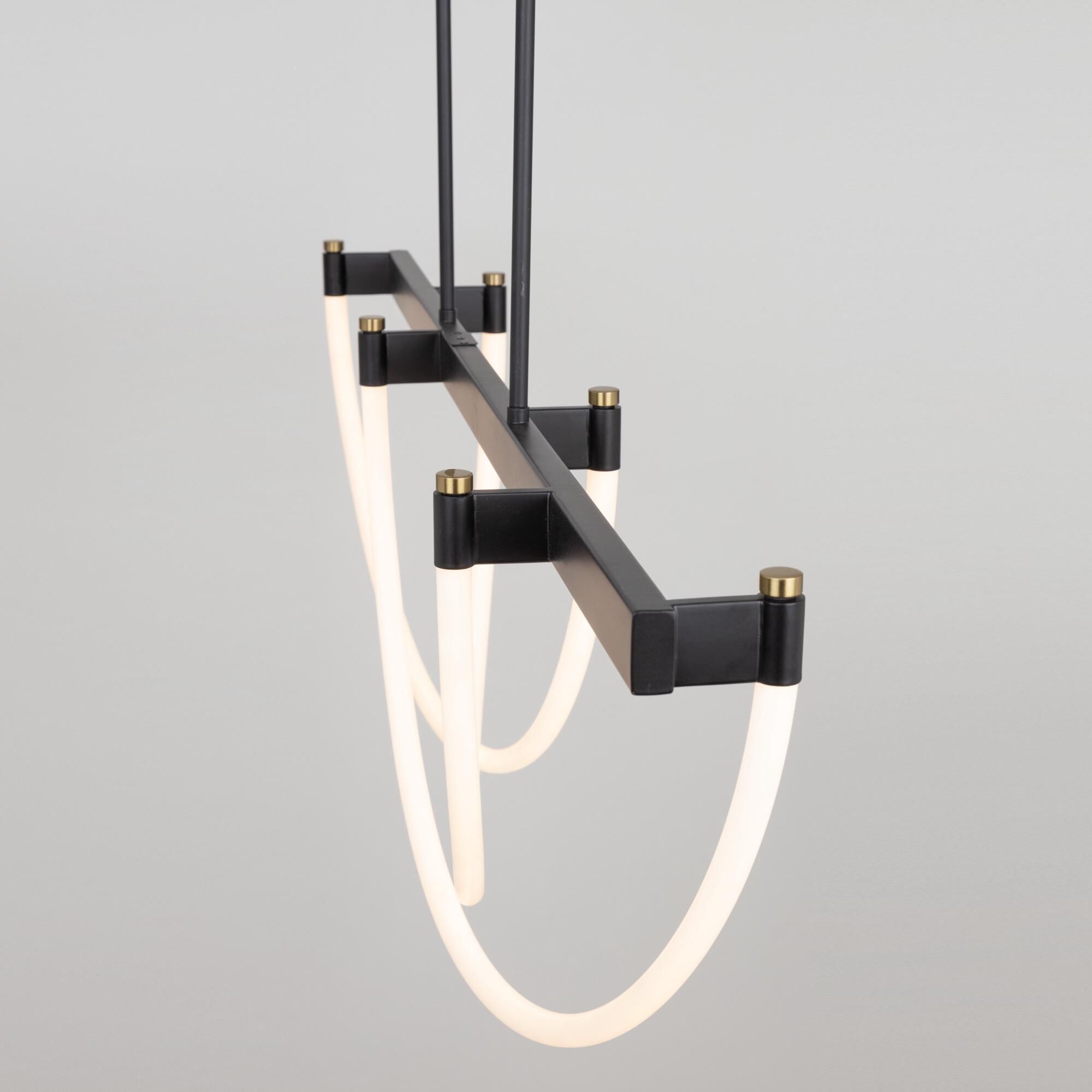 Shown in Black And Brushed Brass finish and Silicone shade
