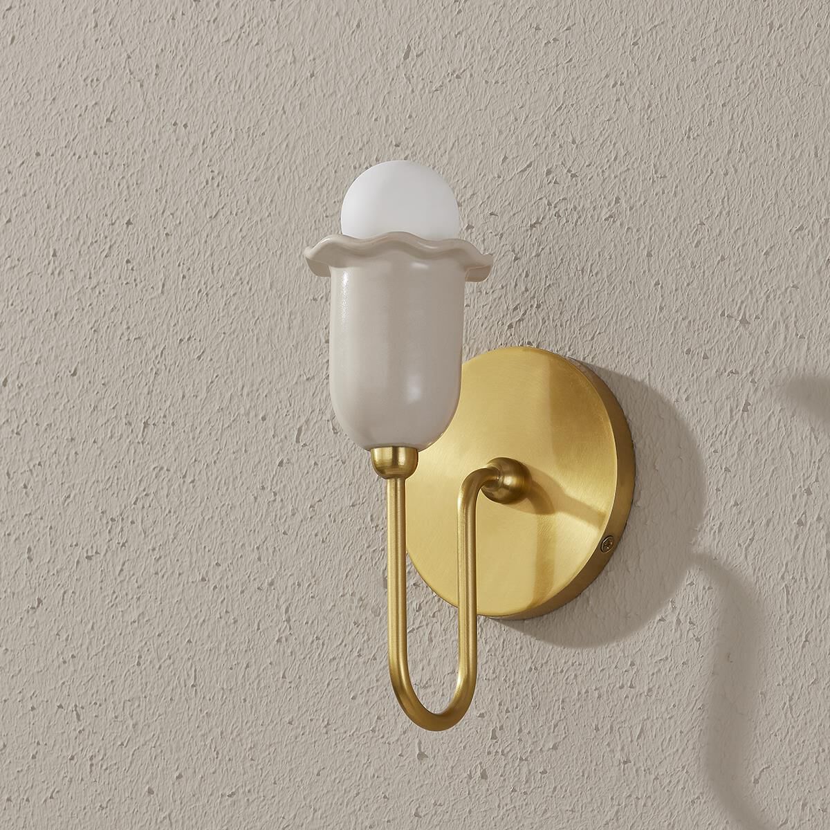 Shown in Aged Brass finish and Ceramic glass