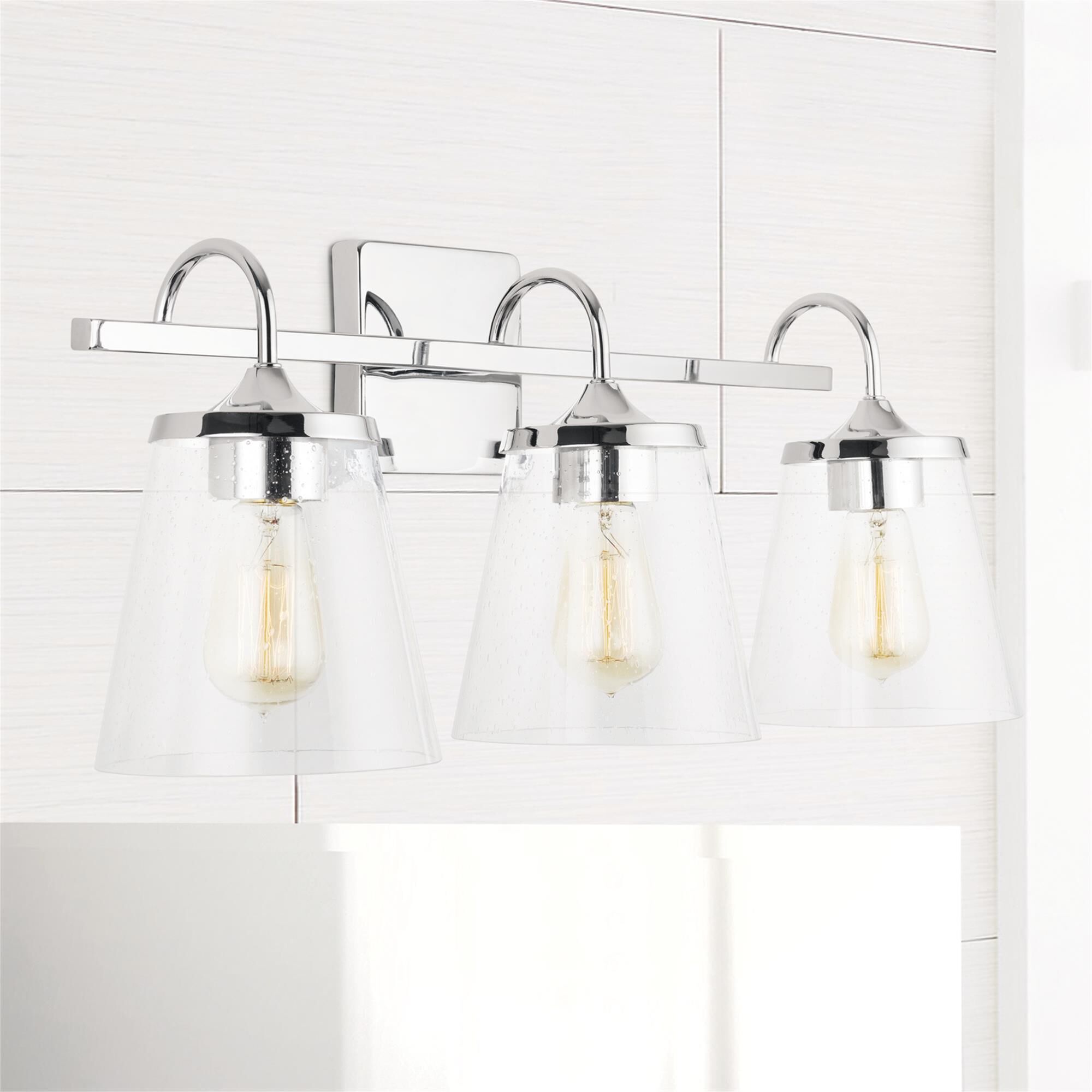 Shown in Chrome finish and Clear Seeded glass