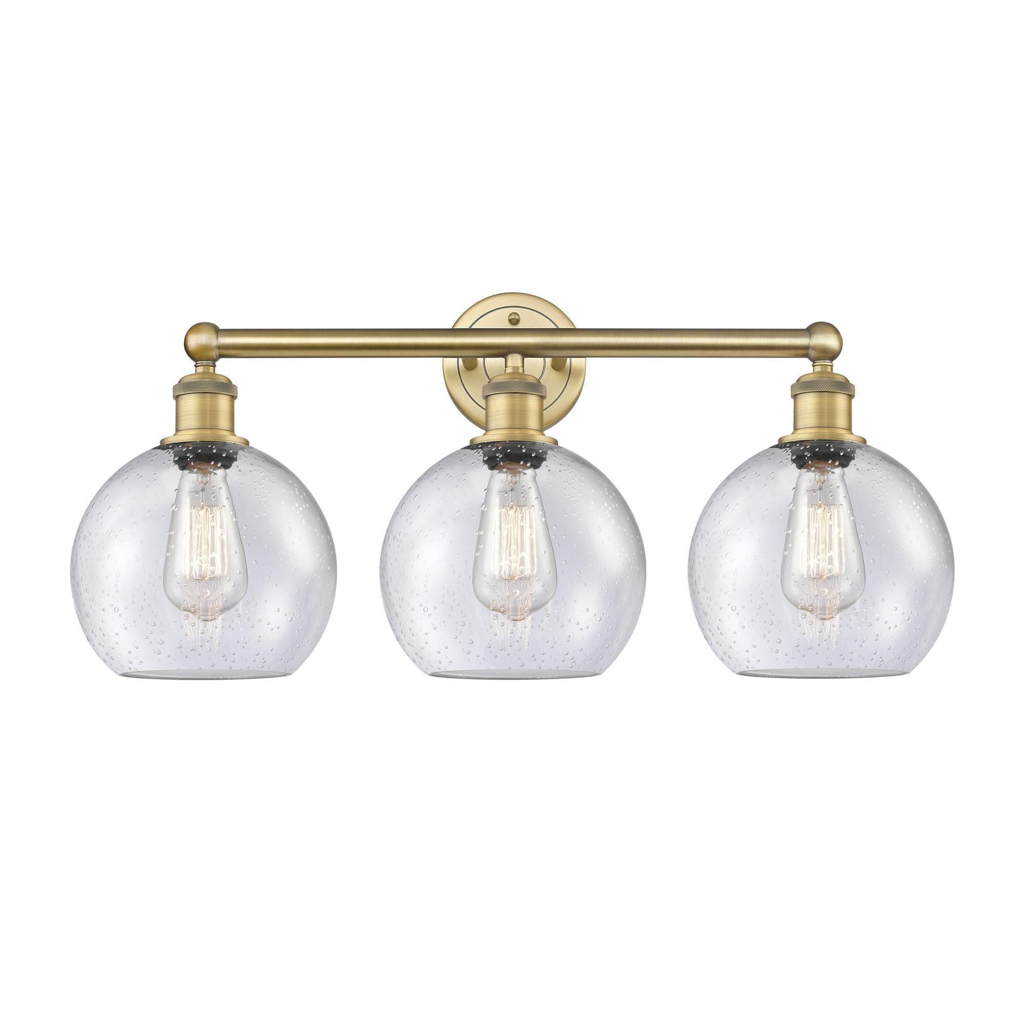 Shown in Brushed Brass finish and Seedy glass