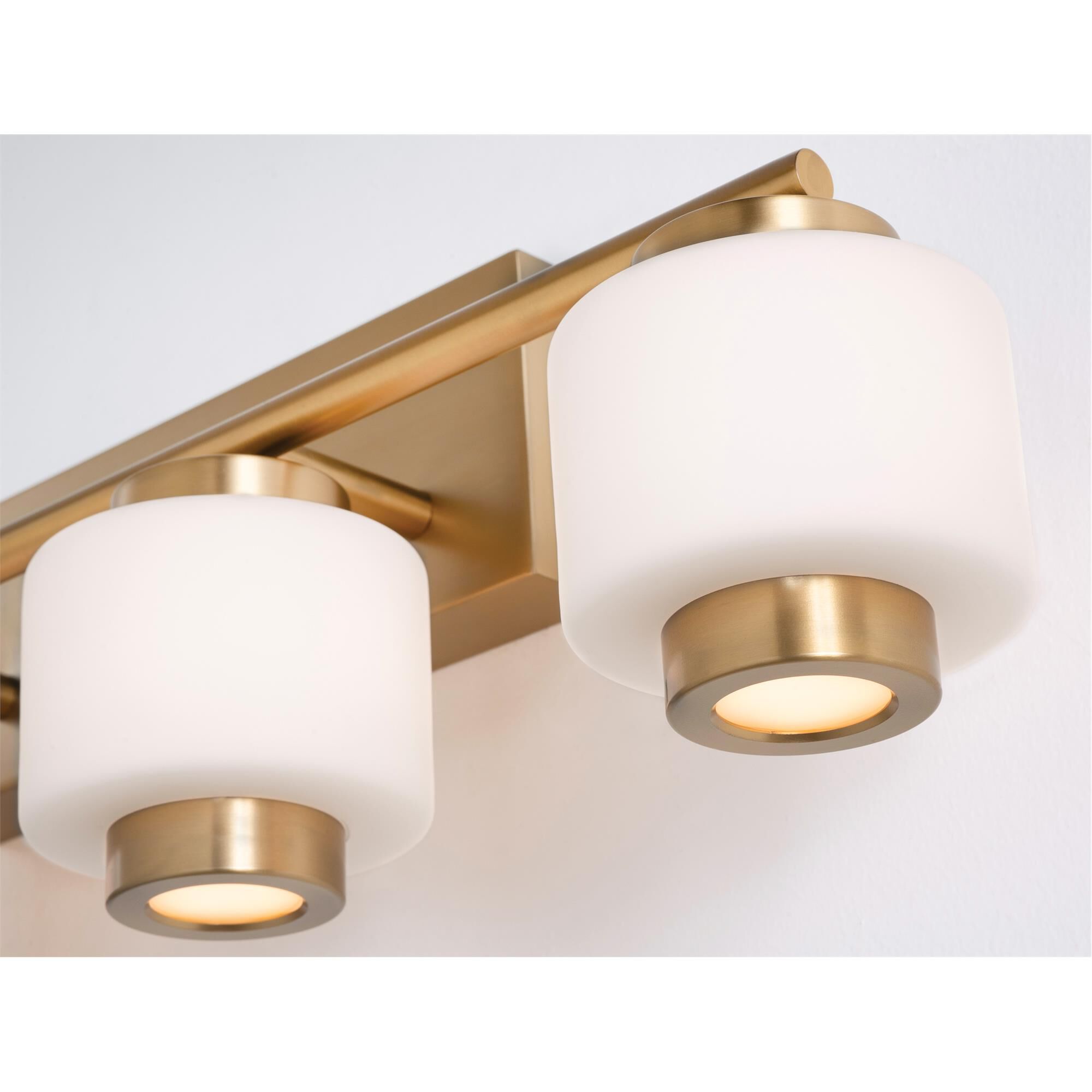 Shown in Light Antique Brass finish and White glass