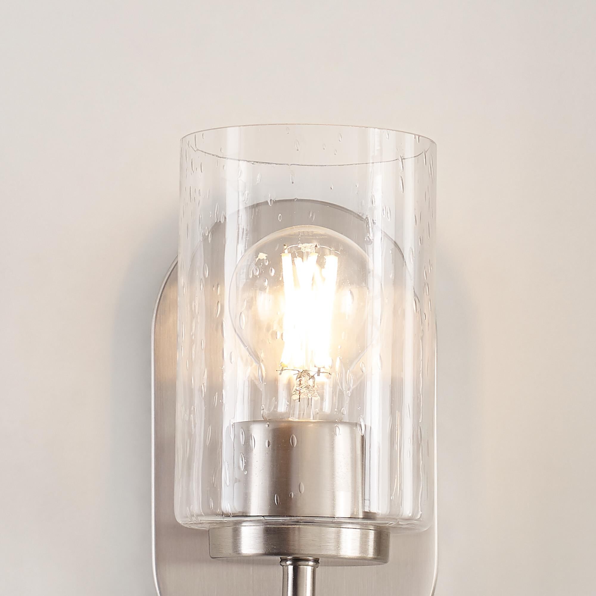 Shown in Brushed Nickel finish and Clear Seeded glass