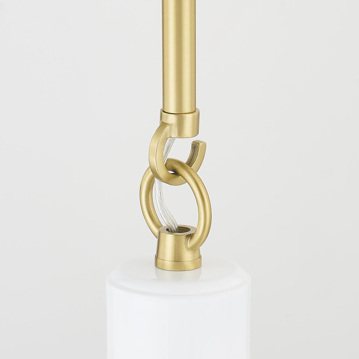 Shown in Aged Brass and Glossy White finish and Metal shade