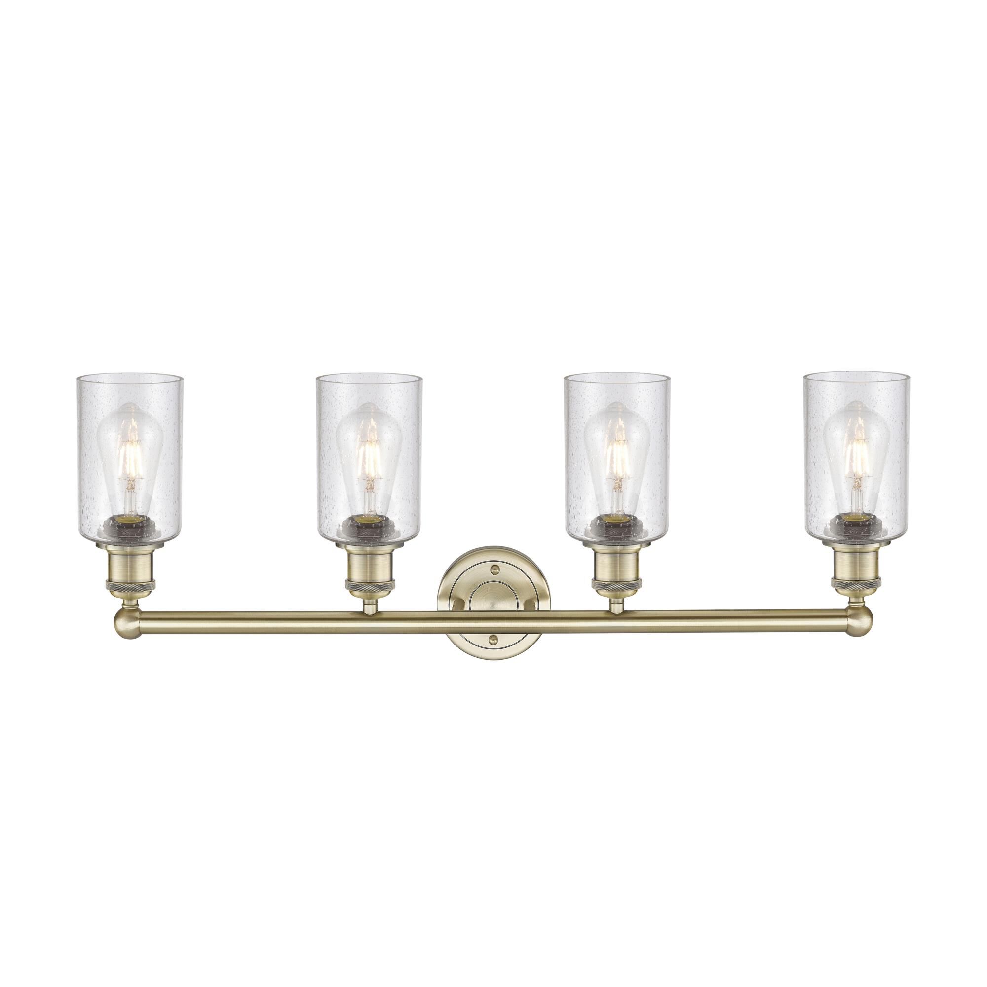 Shown in Antique Brass finish and Seedy glass
