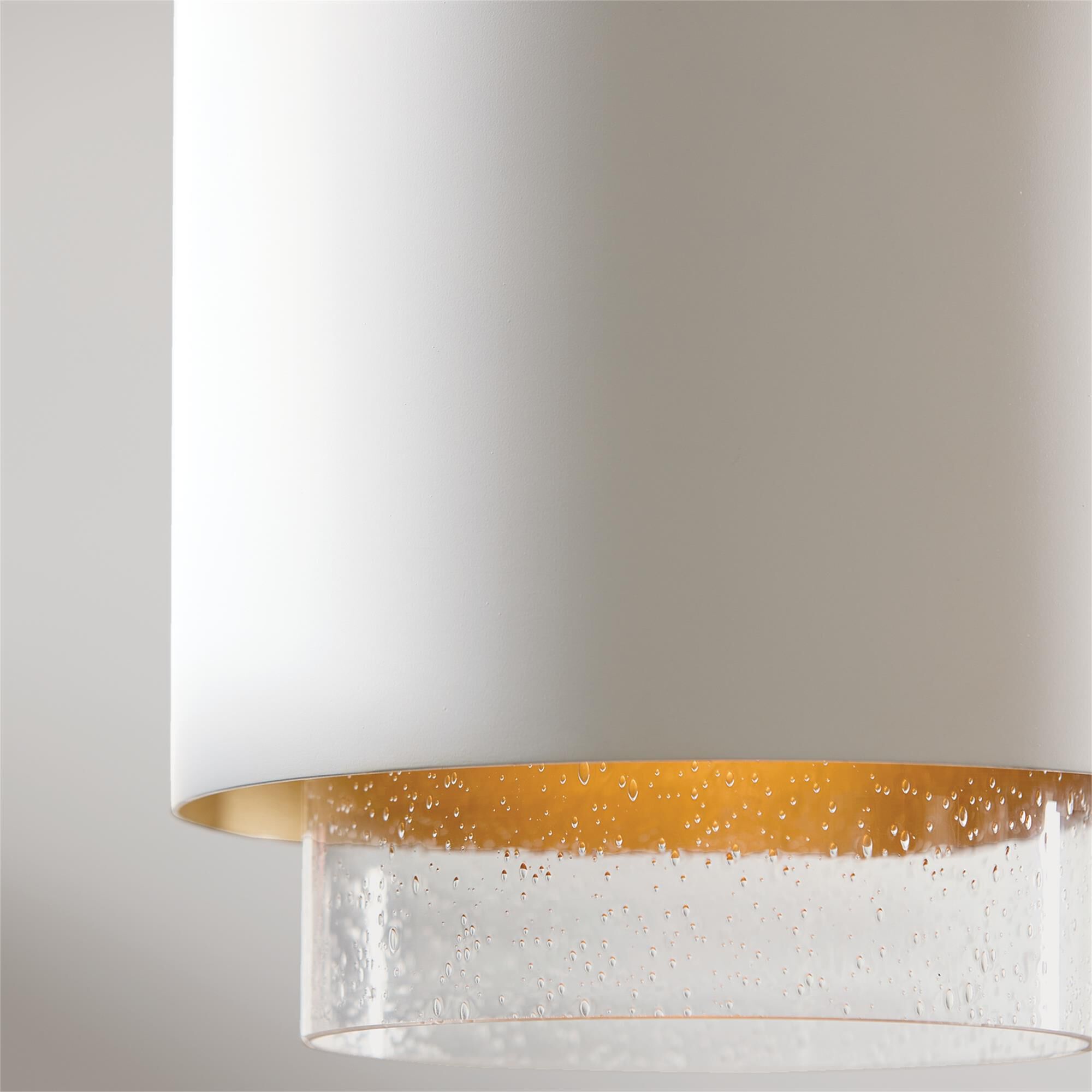 Shown in Matte Brass and White finish and Clear Seeded glass and Metal with Brass Interior shade