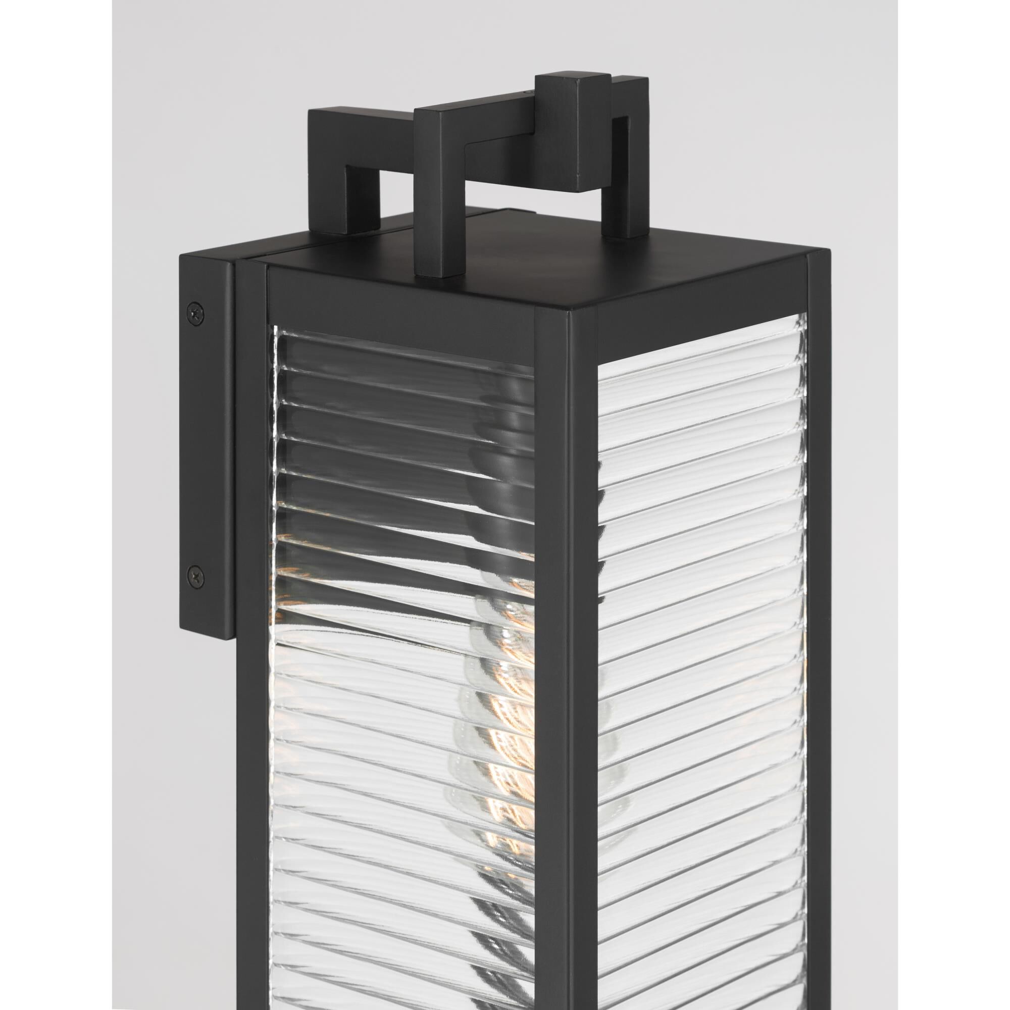Shown in Dark Matte Black finish and Clear Ribbed glass