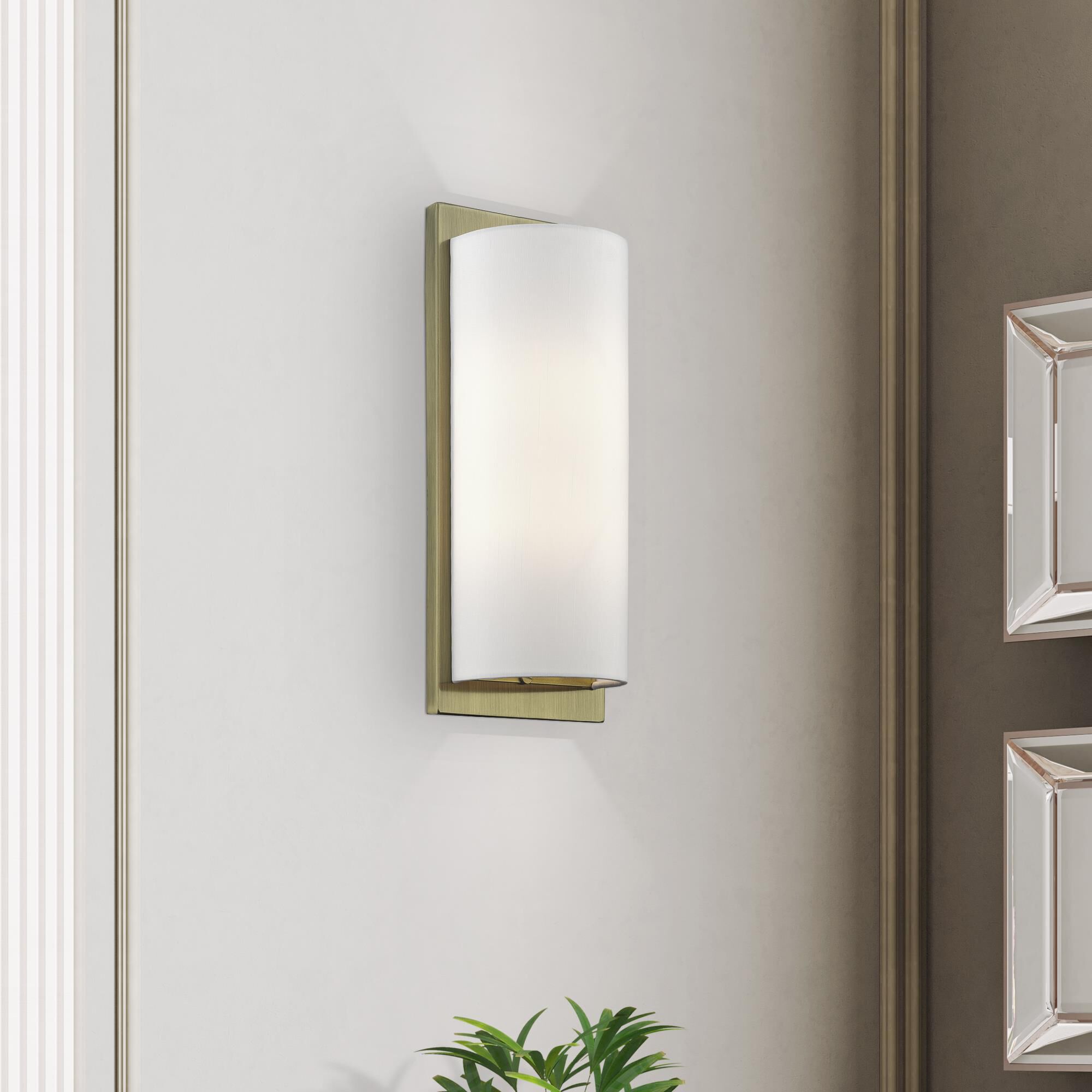 Shown in Antique Brass finish and Hand Crafted Off-White Fabric Hardback shade