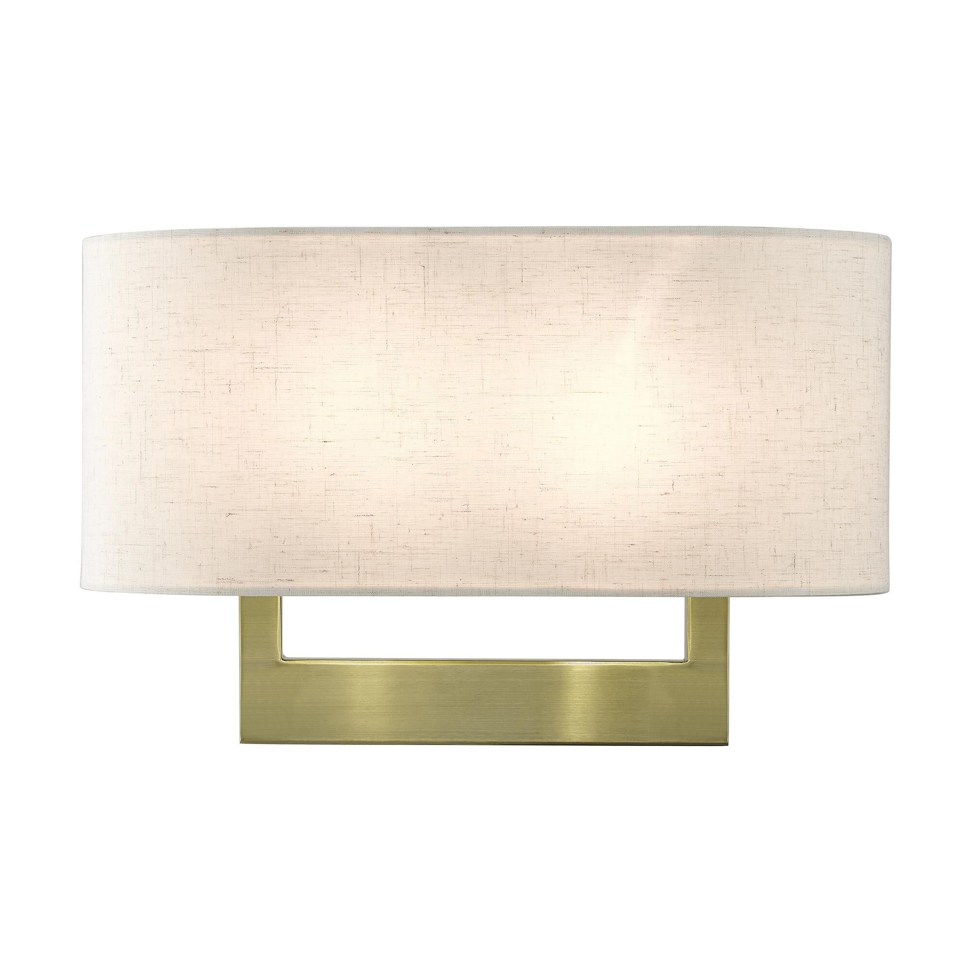 Shown in Antique Brass finish and Hand Crafted Oatmeal Color Hardback Fabric  With White Fabric Inside shade