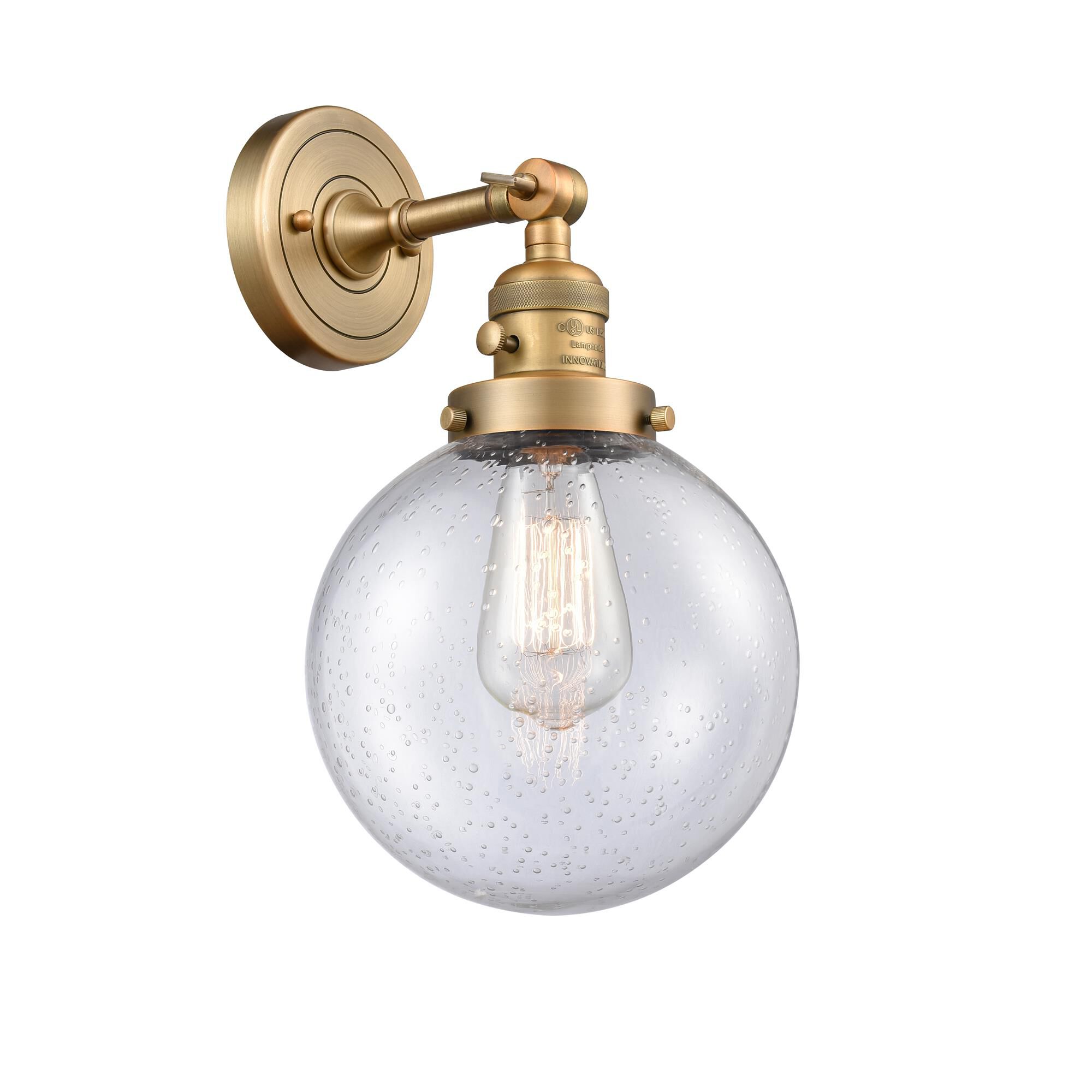 Shown in Brushed Brass finish and Seedy glass and Switch on Socket accent