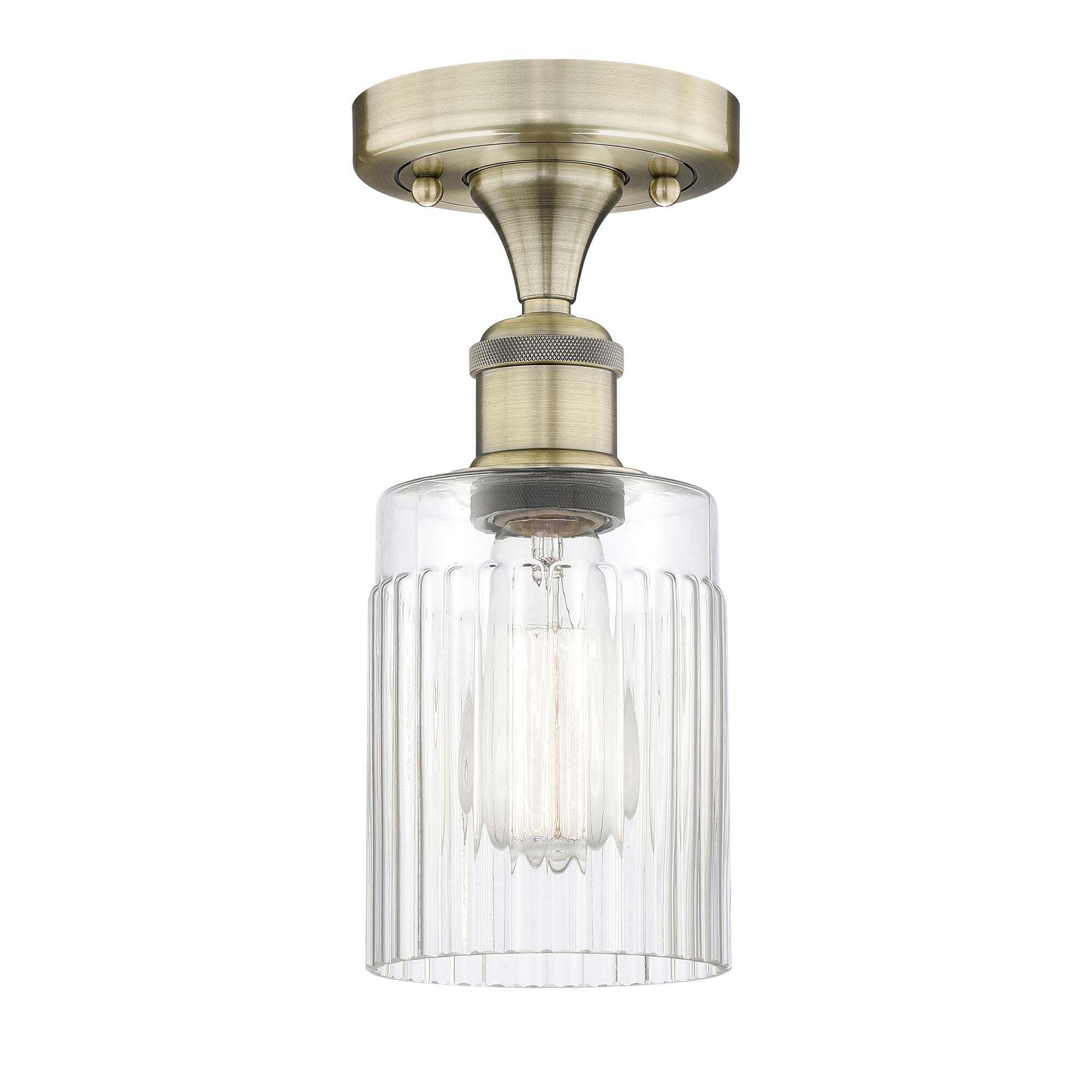 Shown in Antique Brass finish and Clear glass