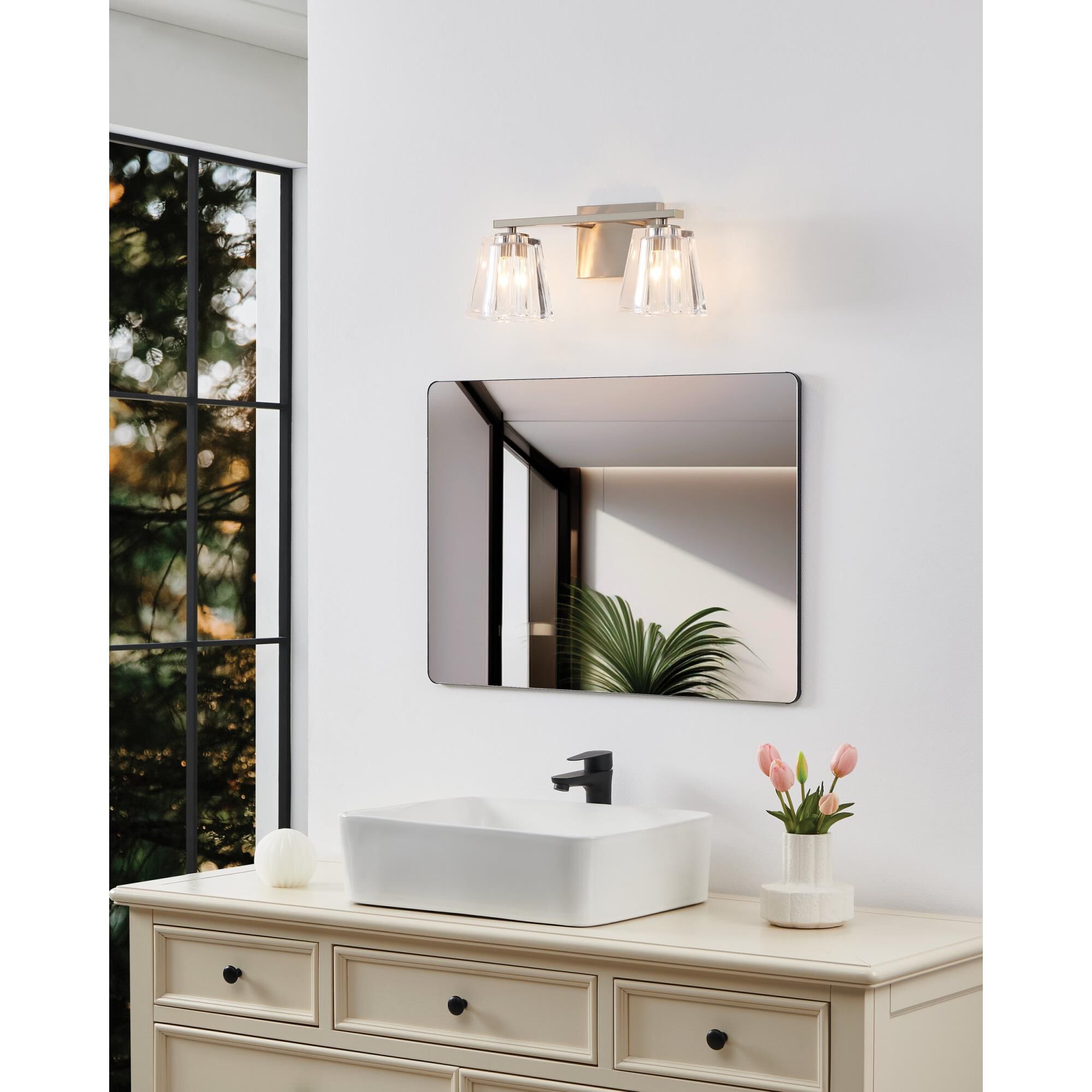 Shown in Brushed Nickel finish and Clear Pressed glass