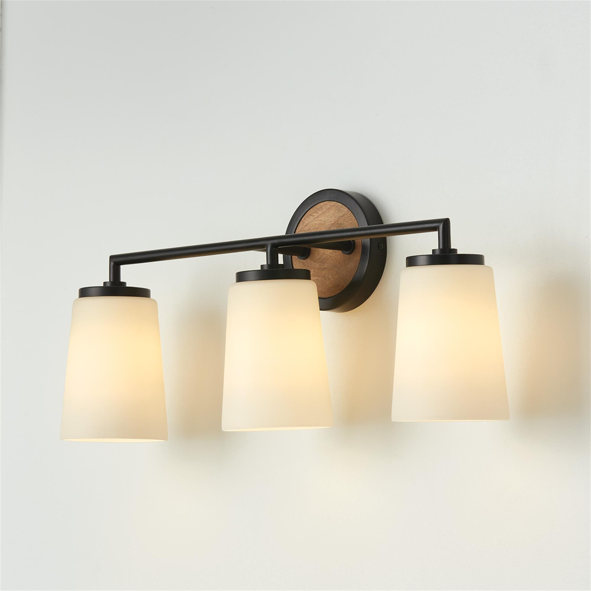 Shown in Light Wood And Matte Black finish and Soft White glass