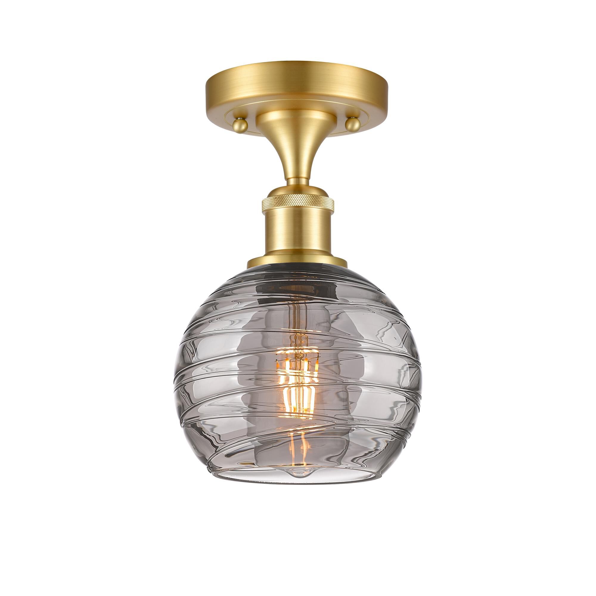 Shown in Satin Gold finish and Light Smoke Deco Swirl glass