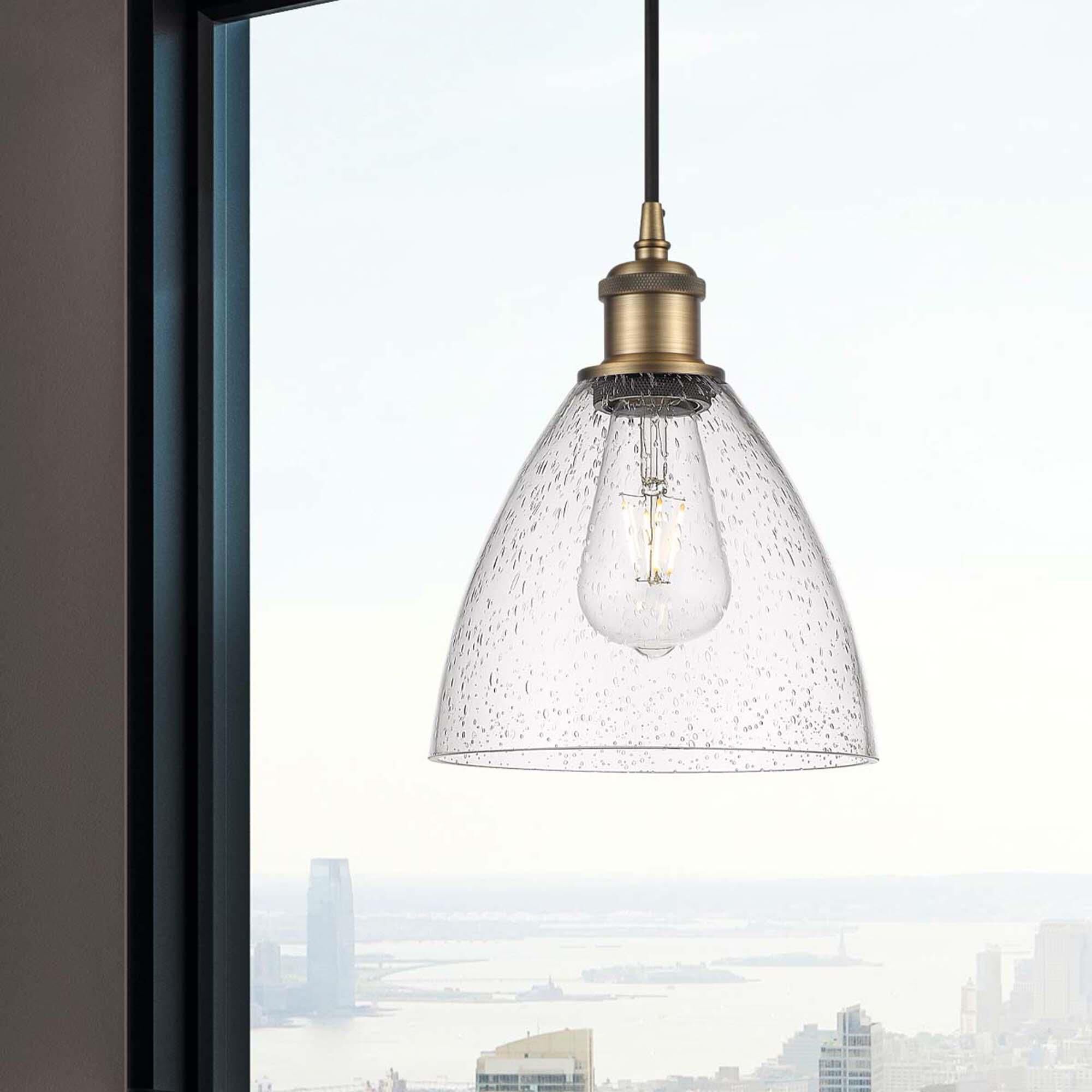 Shown in Brushed Brass finish and Seedy glass