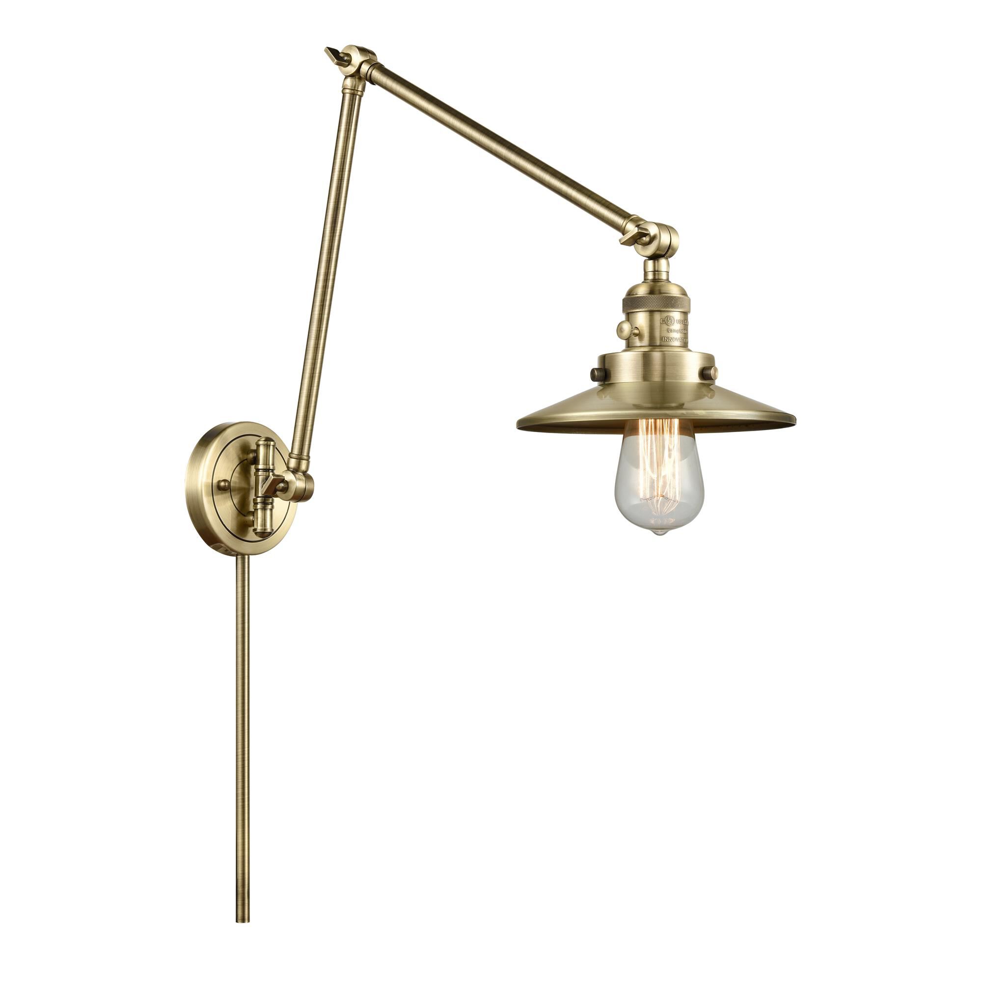 Shown in Antique Brass finish and Antique Brass Railroad shade