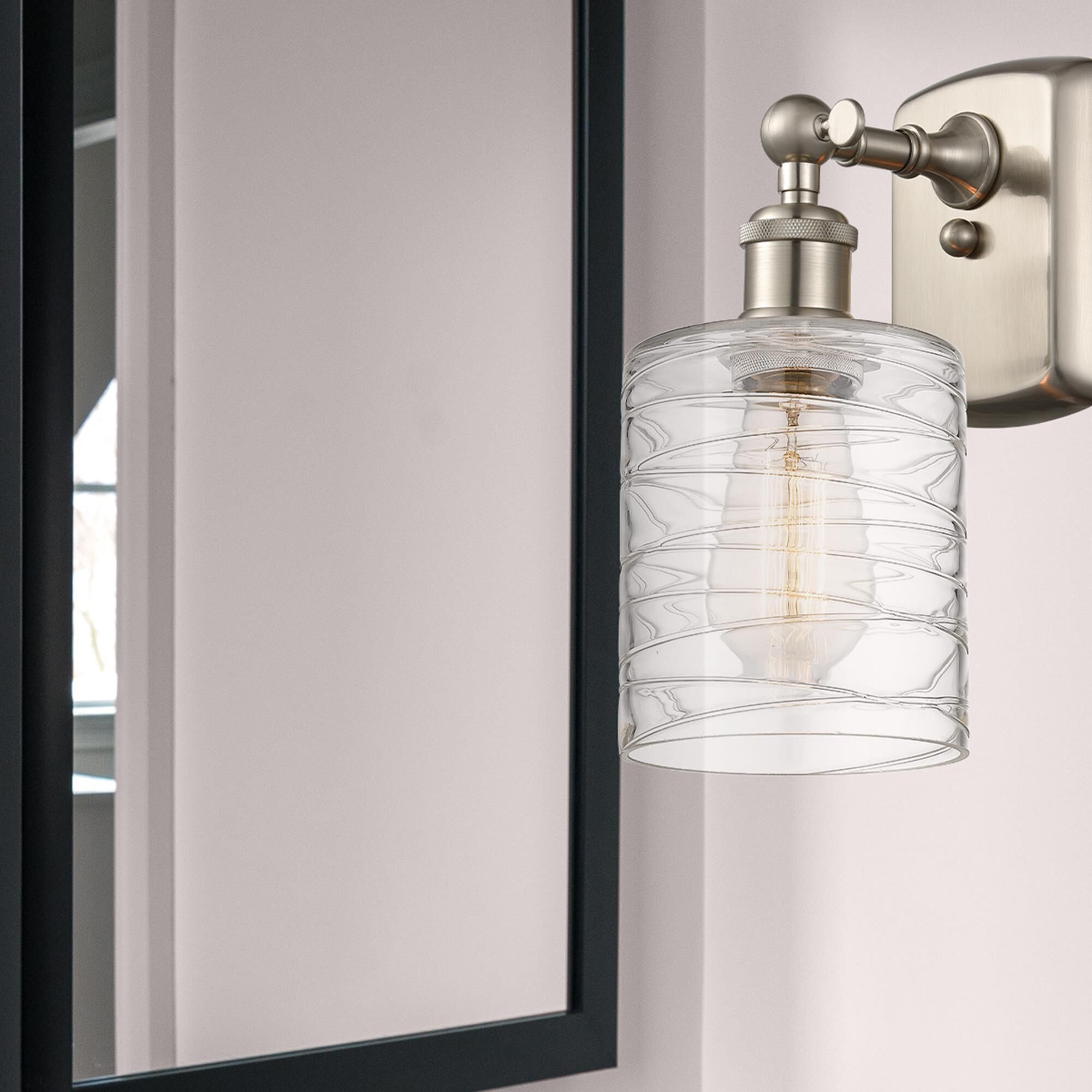 Shown in Brushed Satin Nickel finish and Deco Swirl glass