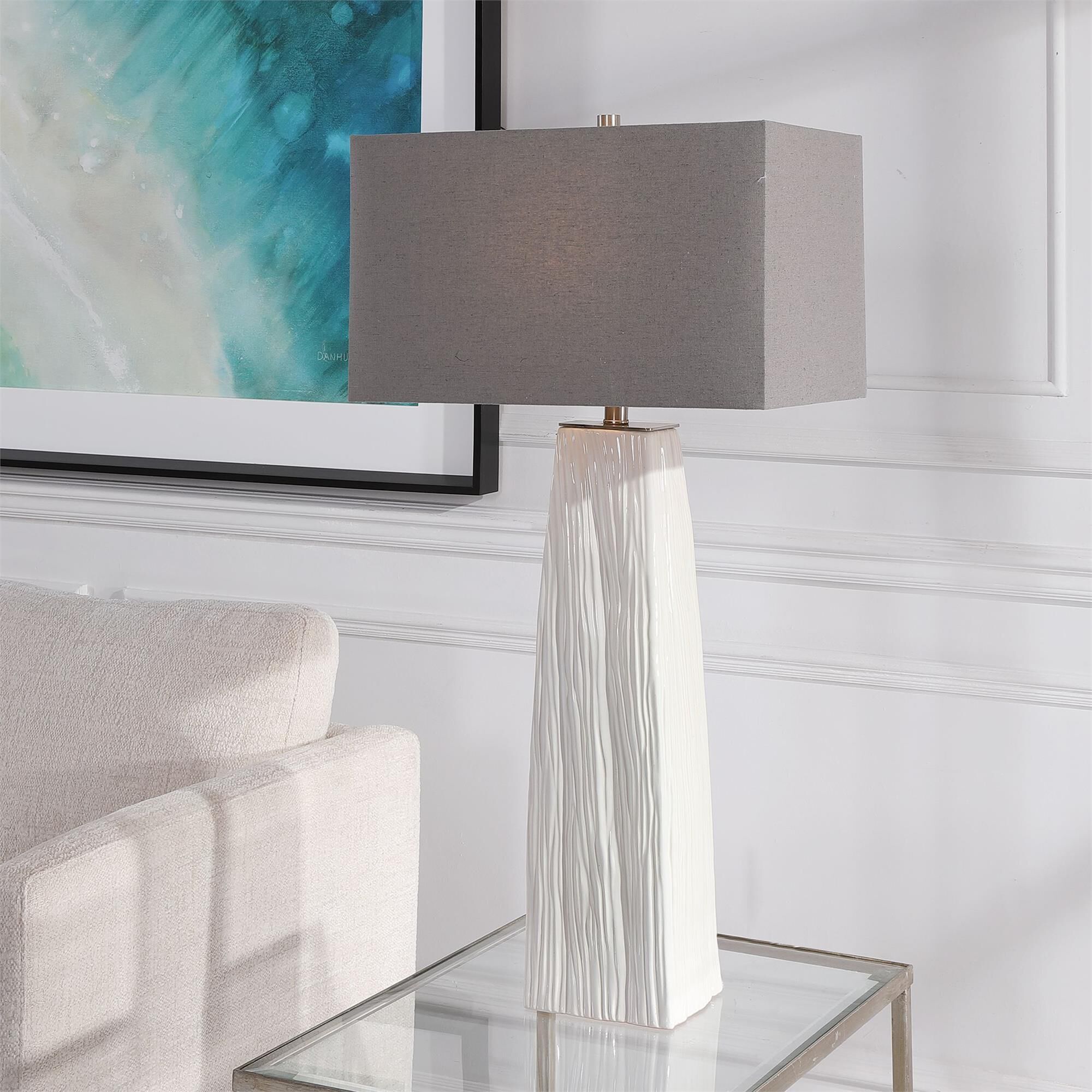 Shown in Elegant And Versatile, This Table Lamp Features A Gloss White Ceramic Base Featuring Organic Hand Ca finish and Rectangle Hardback shade