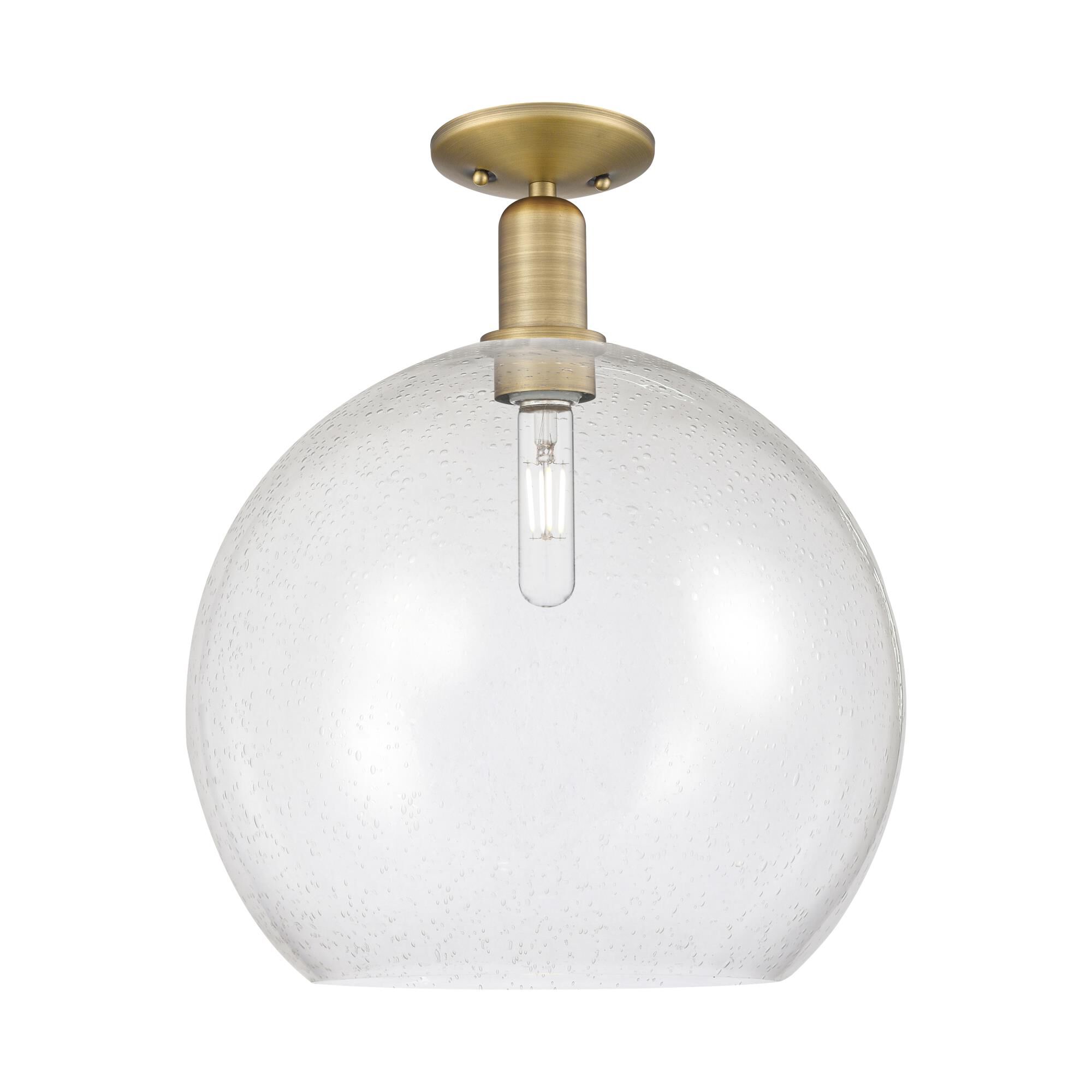 Shown in Brushed Brass finish and Seedy glass