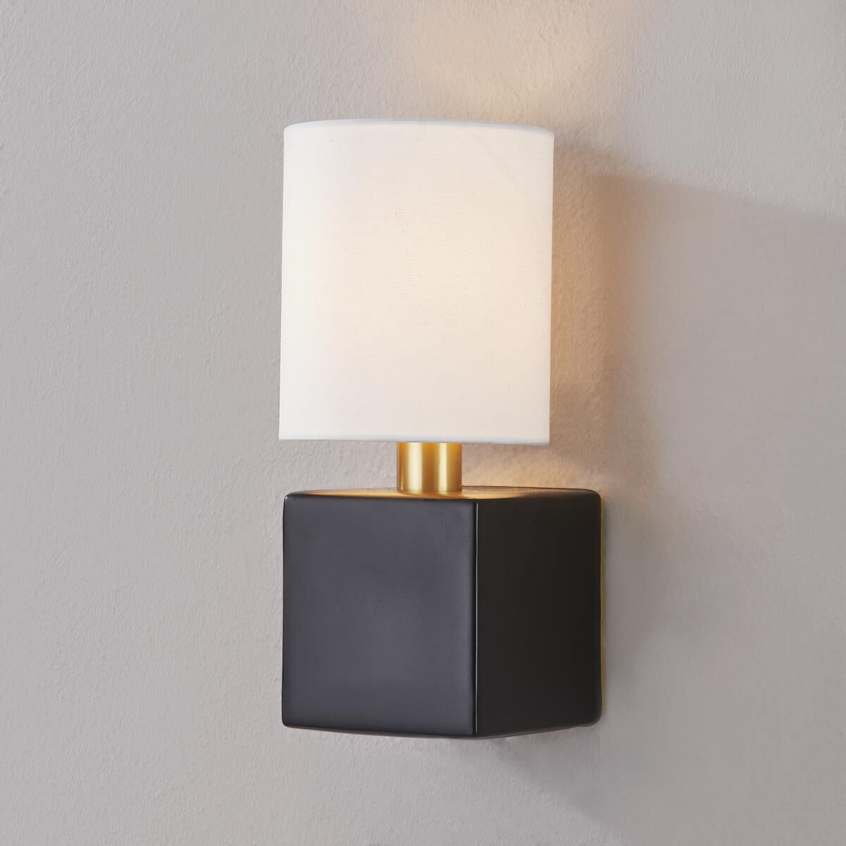 Shown in Aged Brass and Satin Black finish and White Linen shade