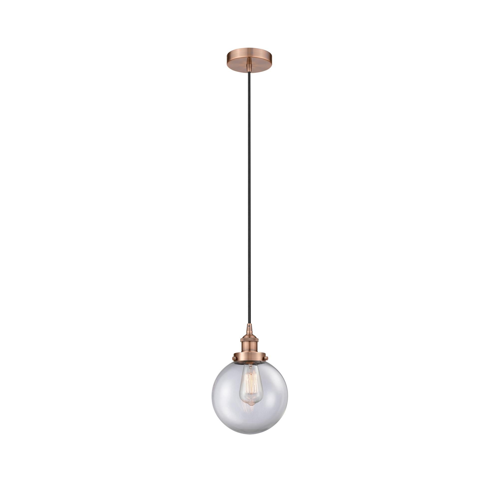 Shown in Antique Copper finish and Clear Beacon glass