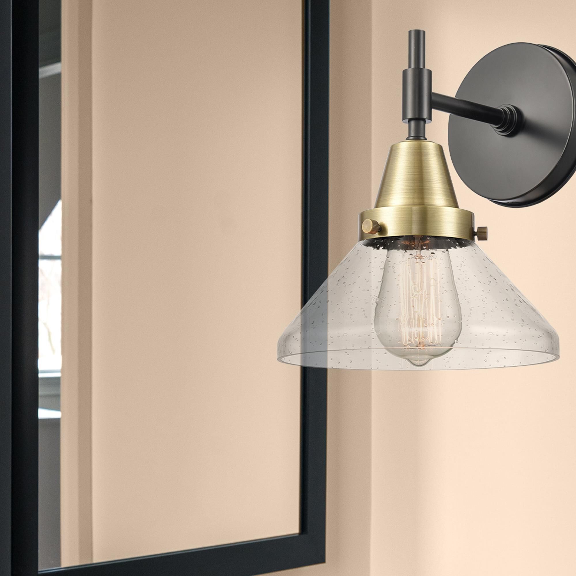 Shown in Black Antique Brass finish and Seedy Caden glass