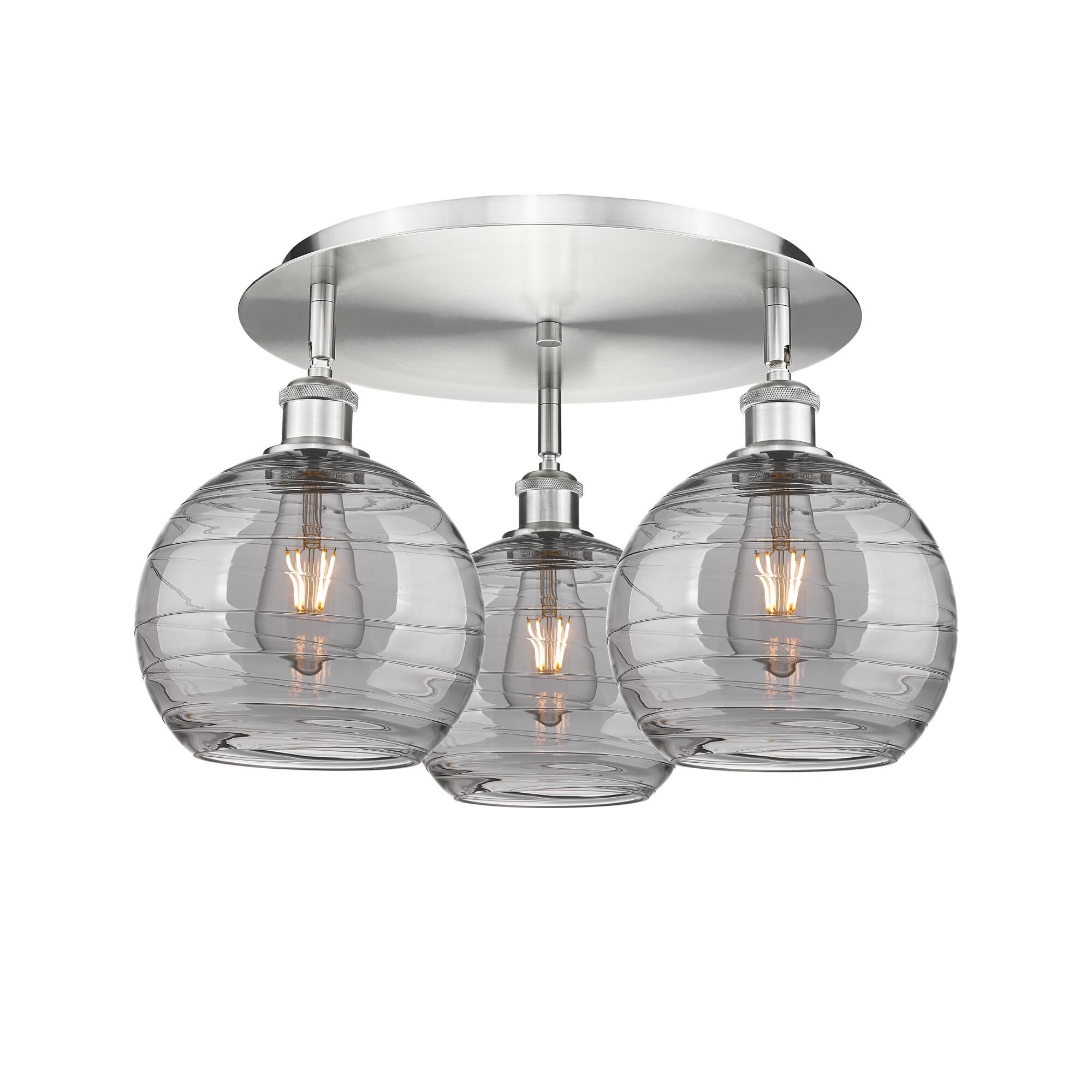 Shown in Satin Nickel finish and Light Smoke Deco Swirl glass