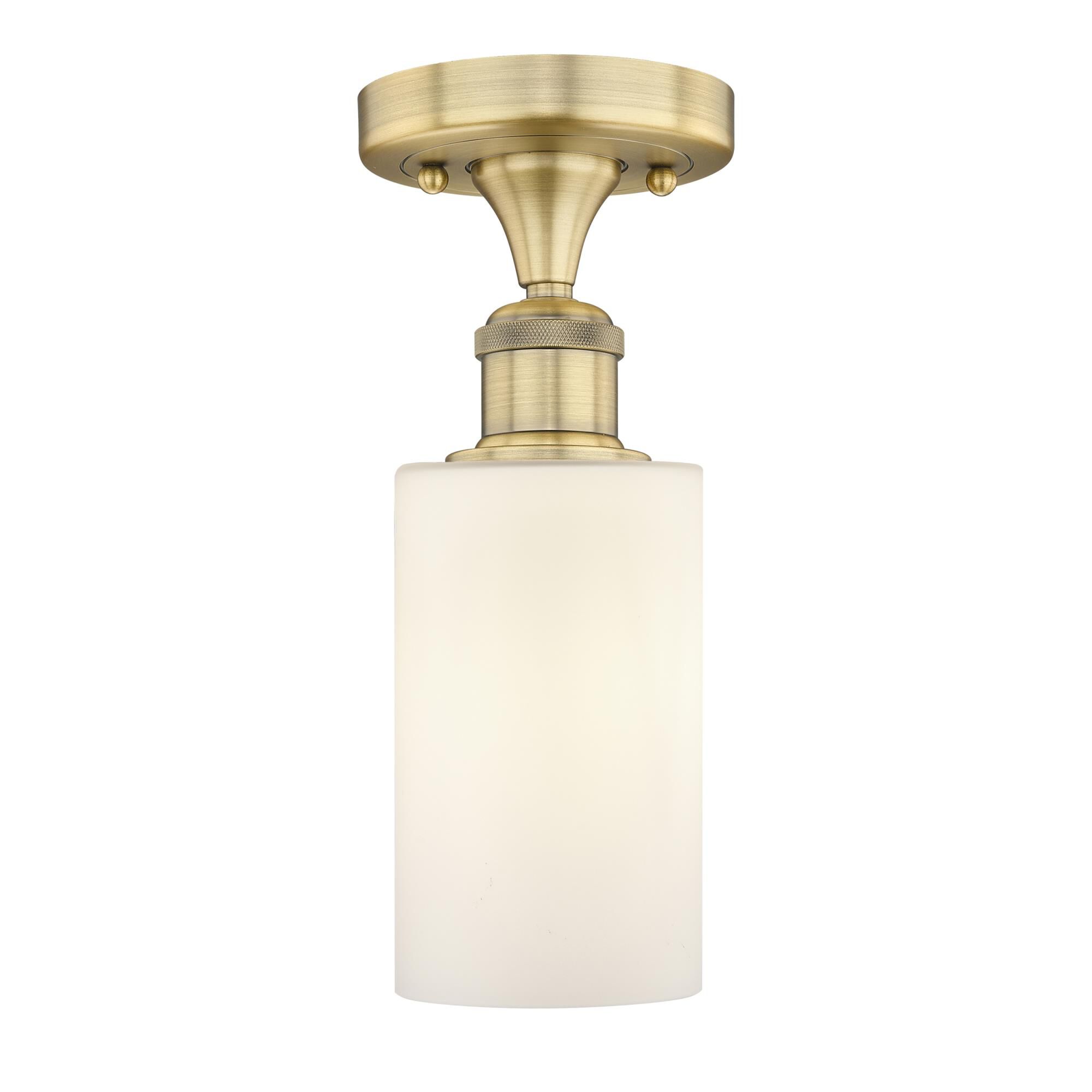 Shown in Brushed Brass finish and Matte White glass