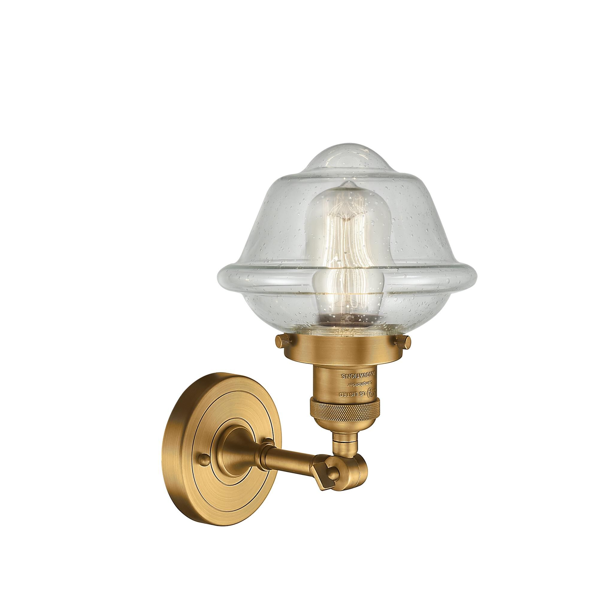 Shown in Brushed Brass finish and Seedy glass