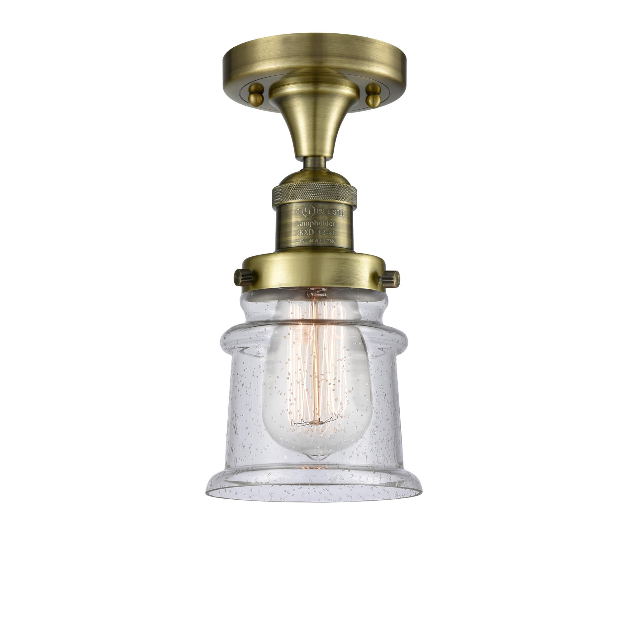 Shown in Antique Brass finish and Seedy glass