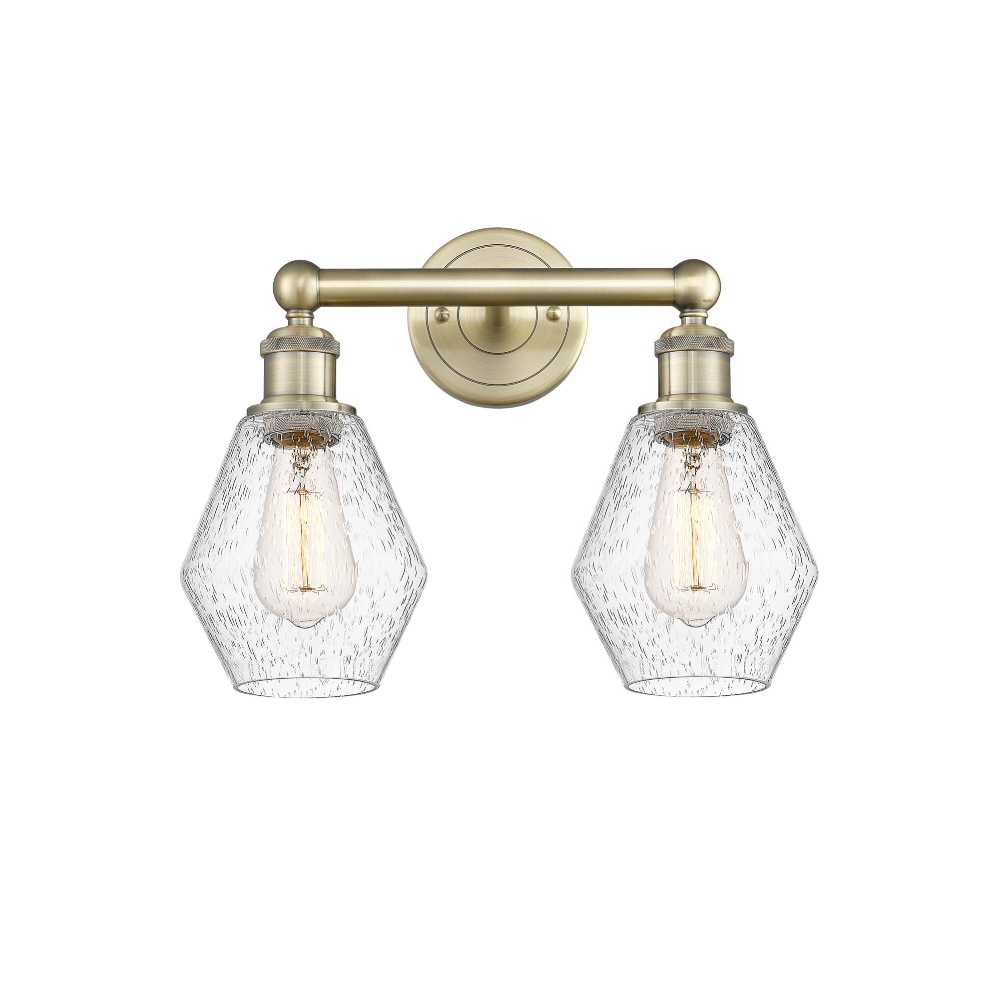 Shown in Antique Brass finish and Seedy glass