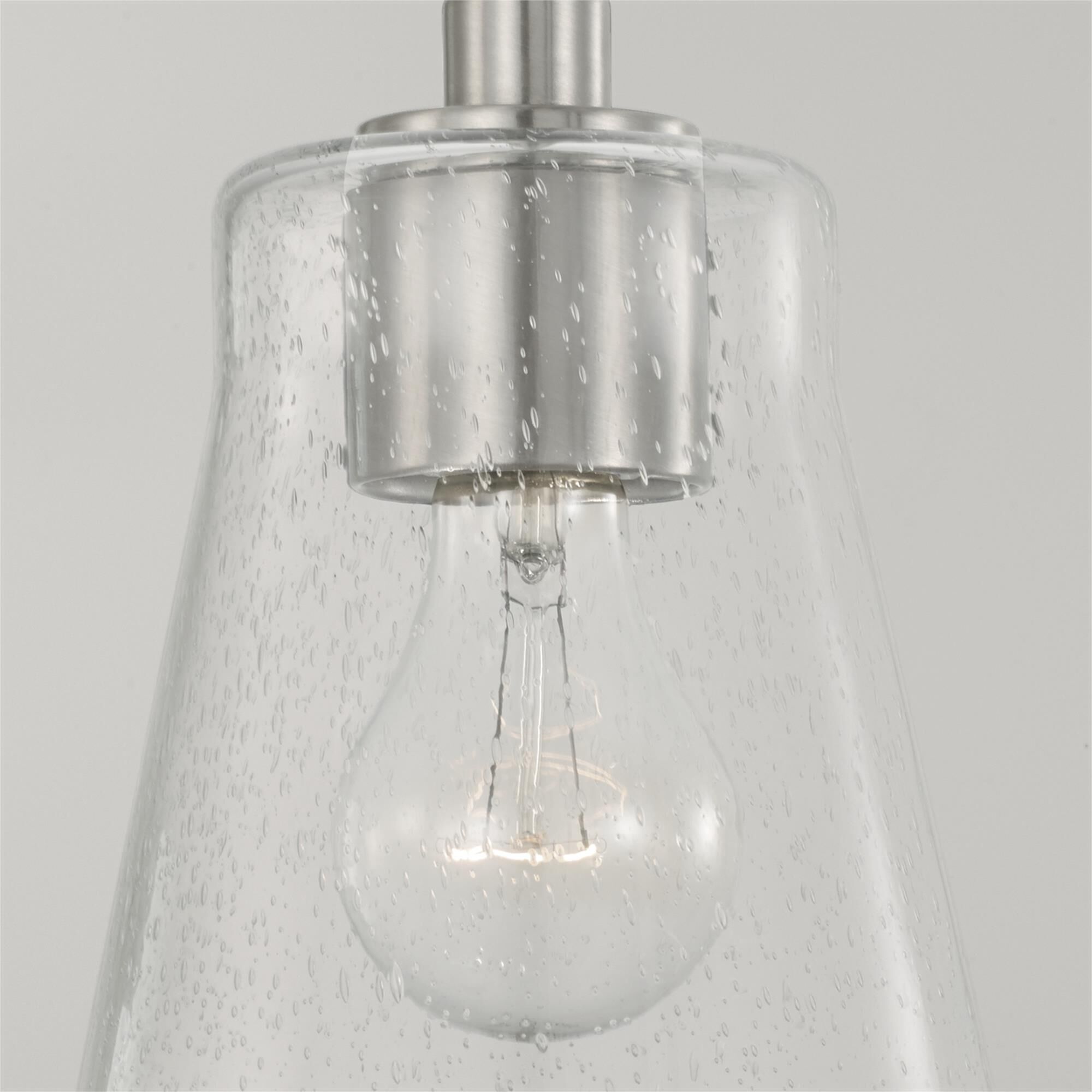Shown in Brushed Nickel finish and Clear Seeded glass
