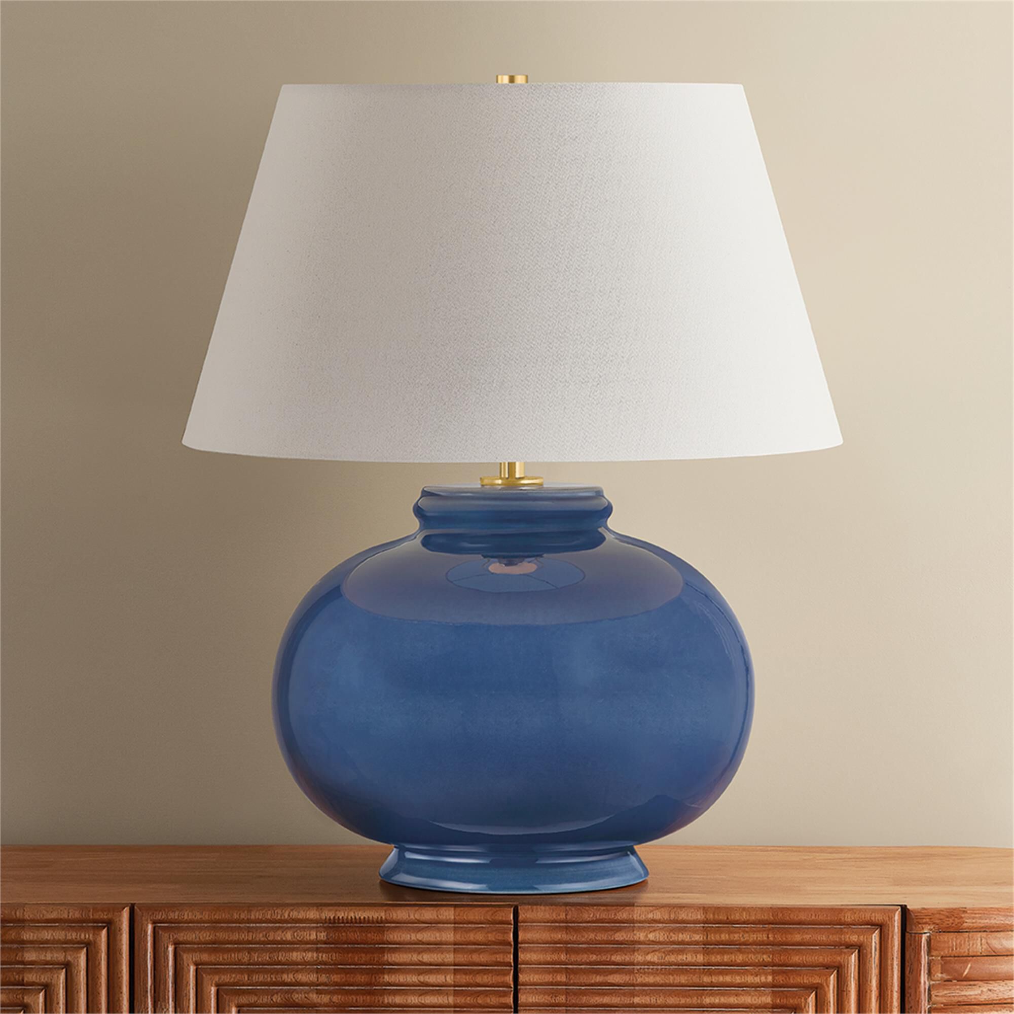 Shown in Aged Brass and Ceramic Parrish Blue finish and Off White Linen shade