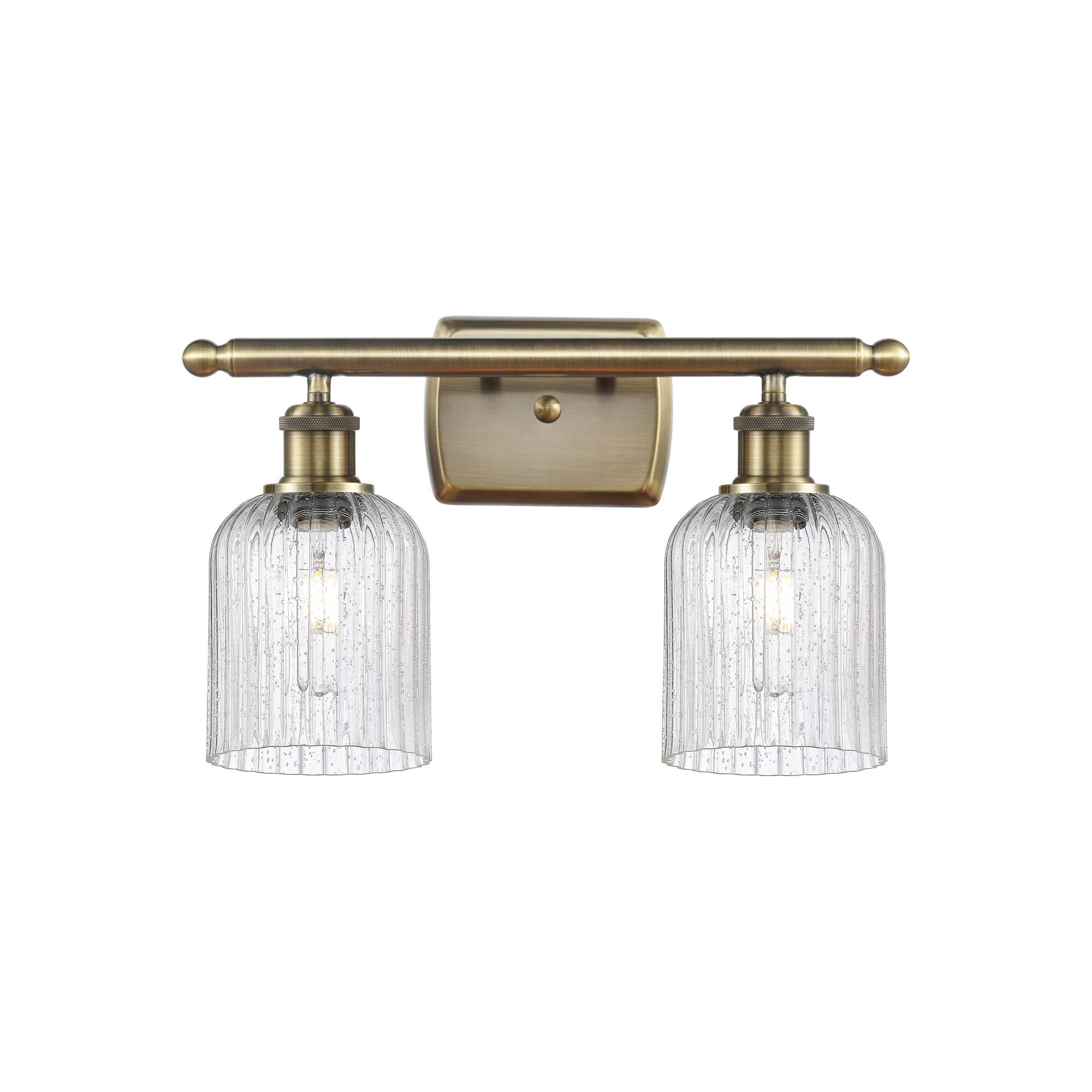 Shown in Antique Brass finish and Seedy shade