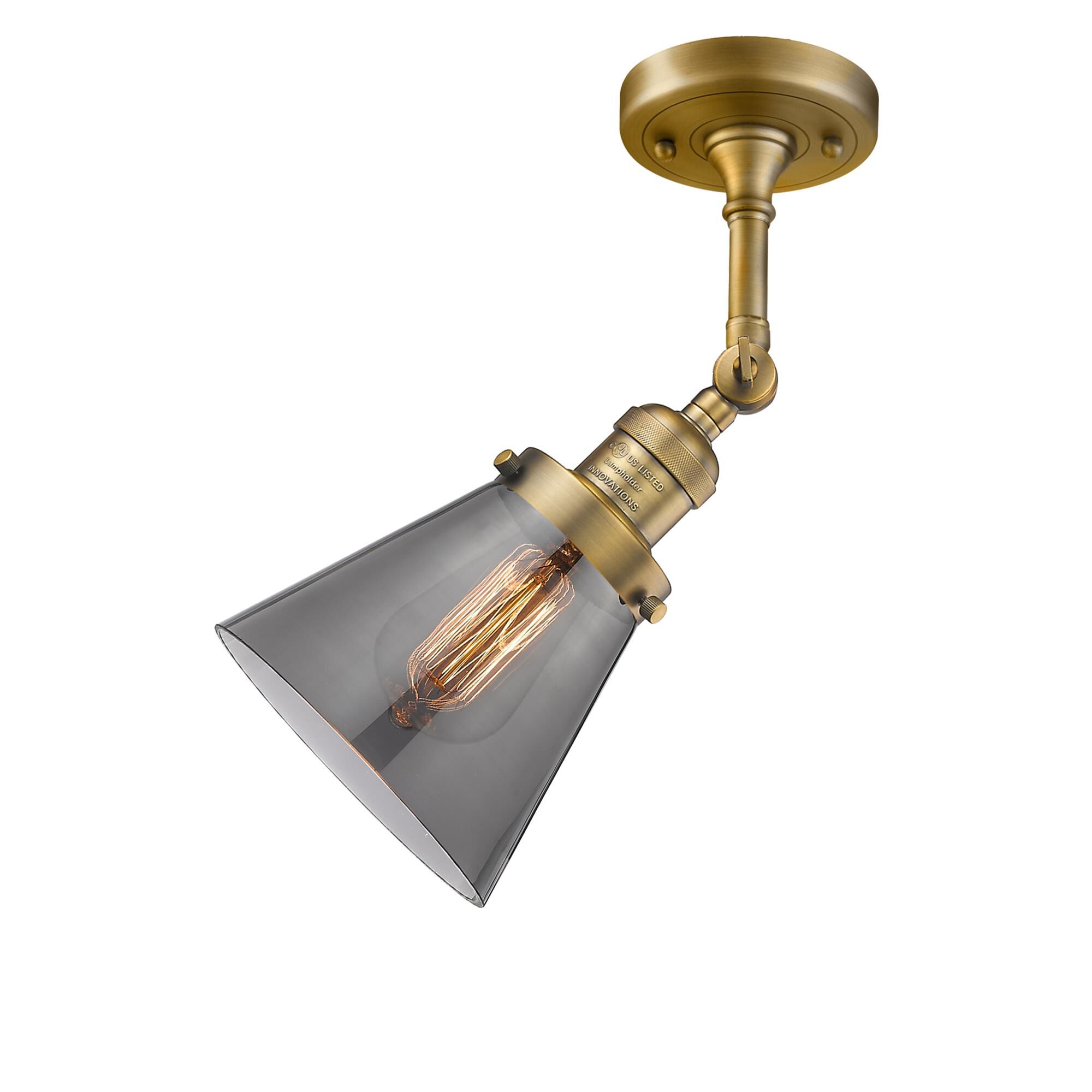 Shown in Brushed Brass finish and Smoked glass and None accent