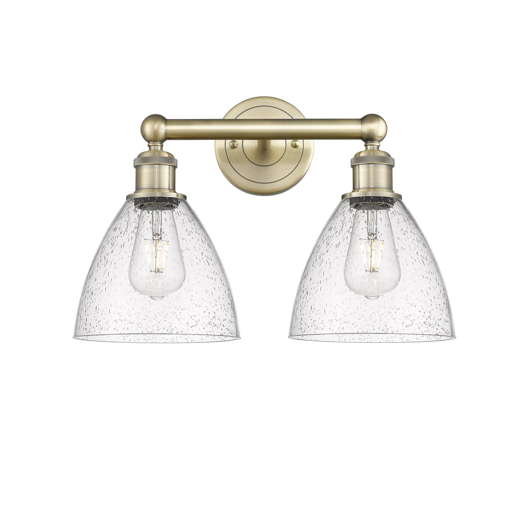 Shown in Antique Brass finish and Seedy glass