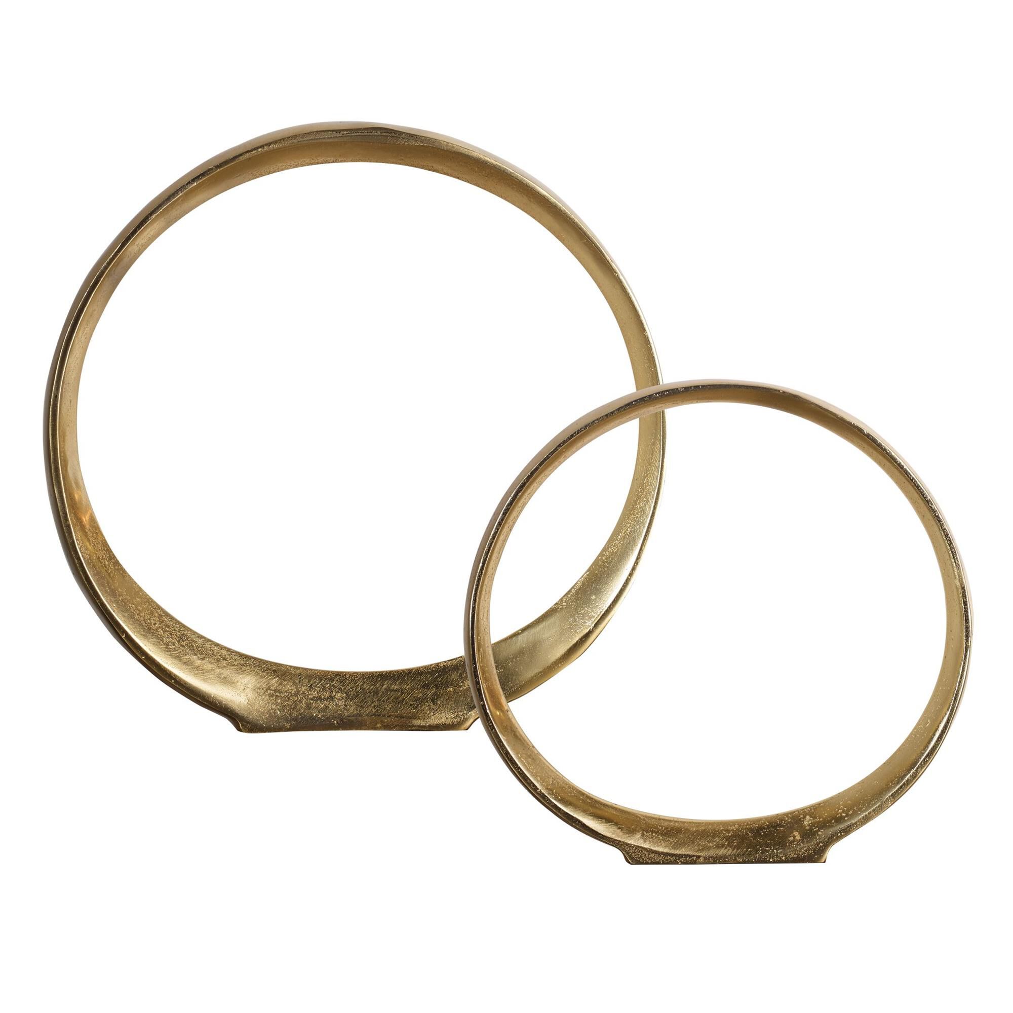 Shown in Set Of Two, Textured Cast Aluminum Ring Sculptures Feature A Clean Gold Finish. finish