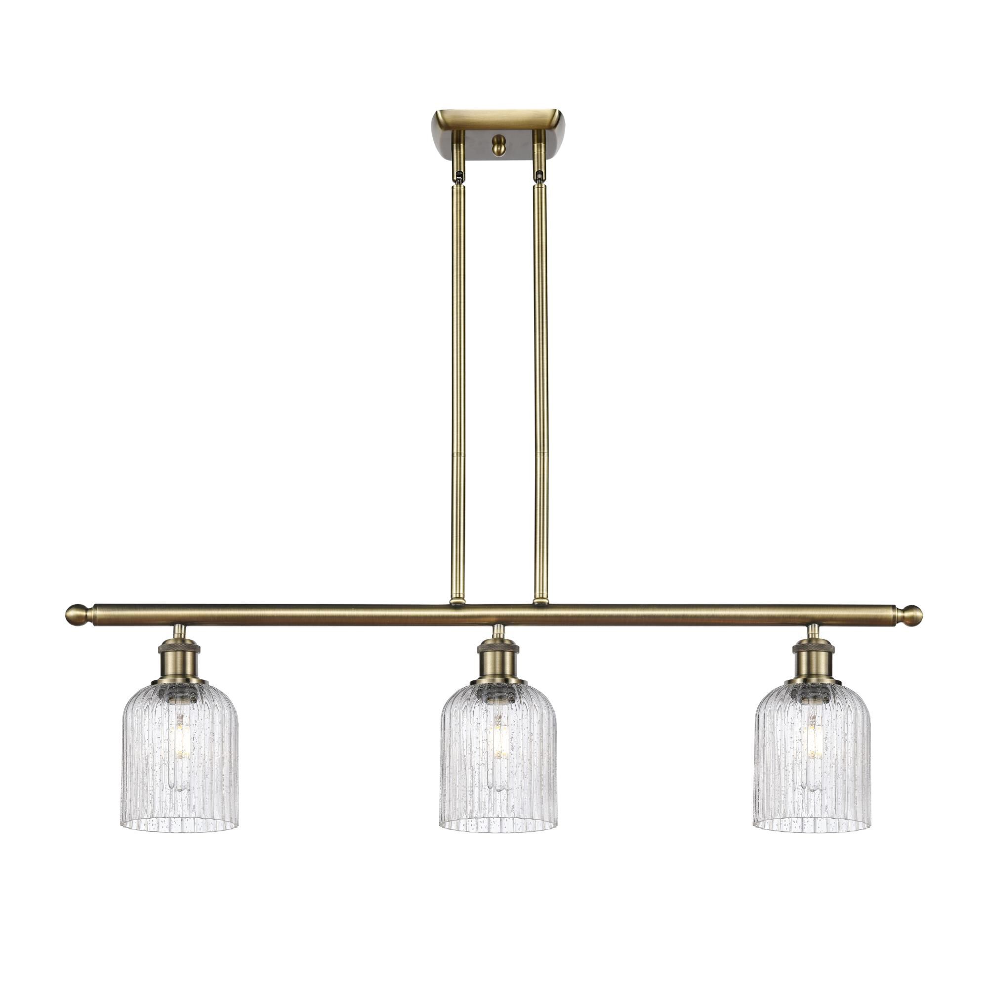 Shown in Antique Brass finish and Seedy shade