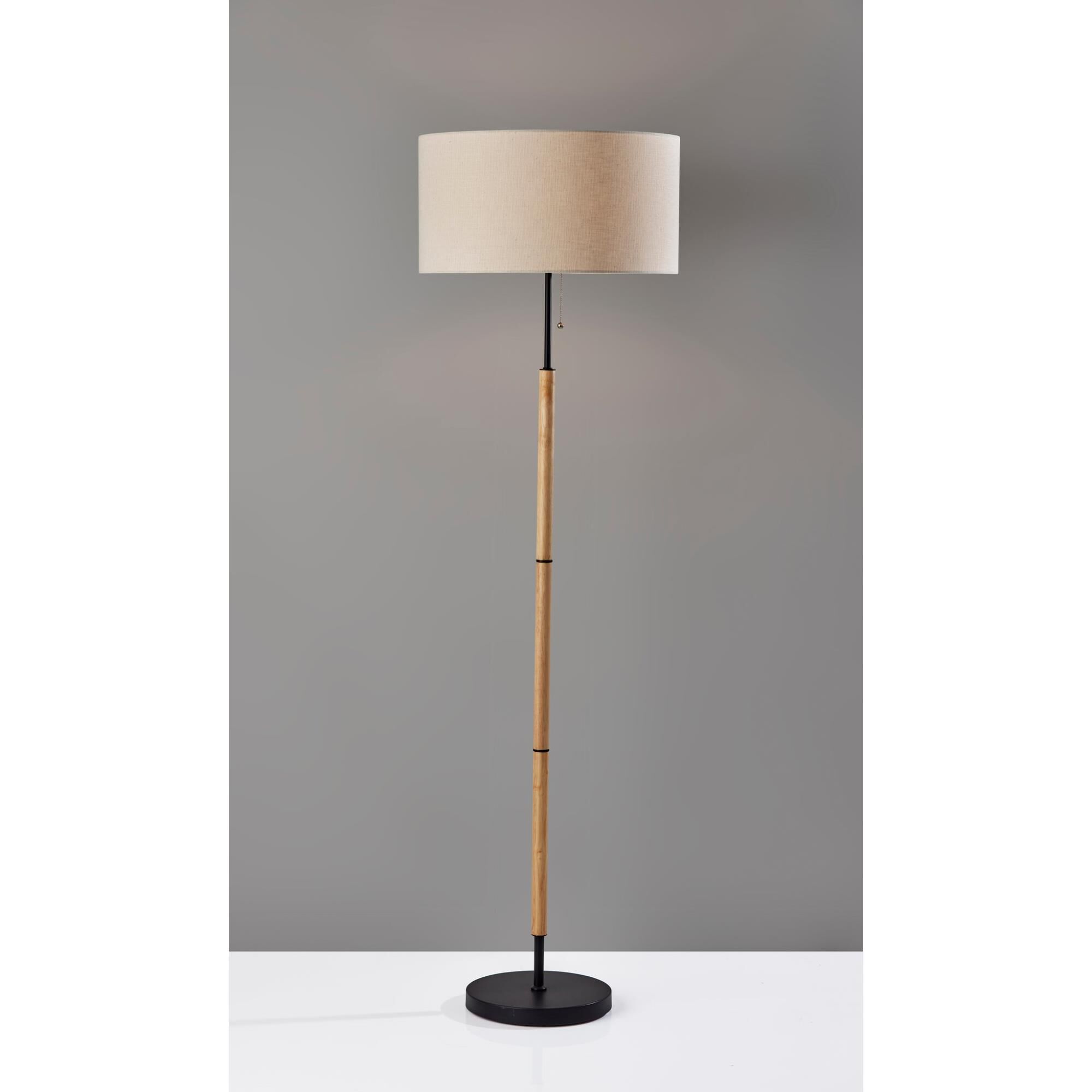 Shown in Natural Wood W. Black Metal finish and Off-White Textured Fabric shade